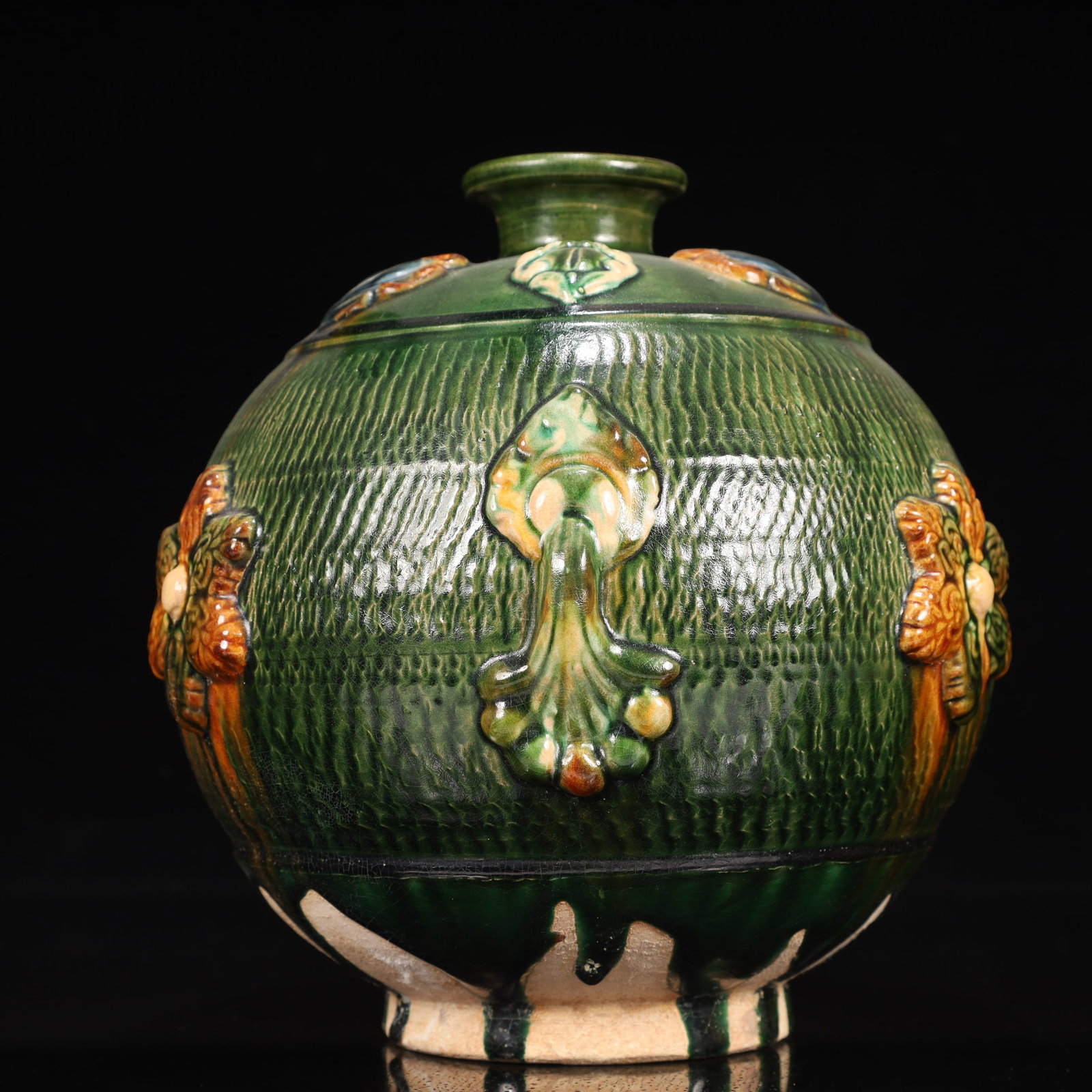 A Rare Tang Tri-Color Glazed Pottery Flower Pattern Jar: A Rare Tang Tri-Color Glazed Pottery Flower Pattern Jar,Tang Dynasty, China,Chinese Tang Tri-colored Pottery, or Tang Sancai, flourished during the Tang Dynasty (618–907 AD). It's renowned for i