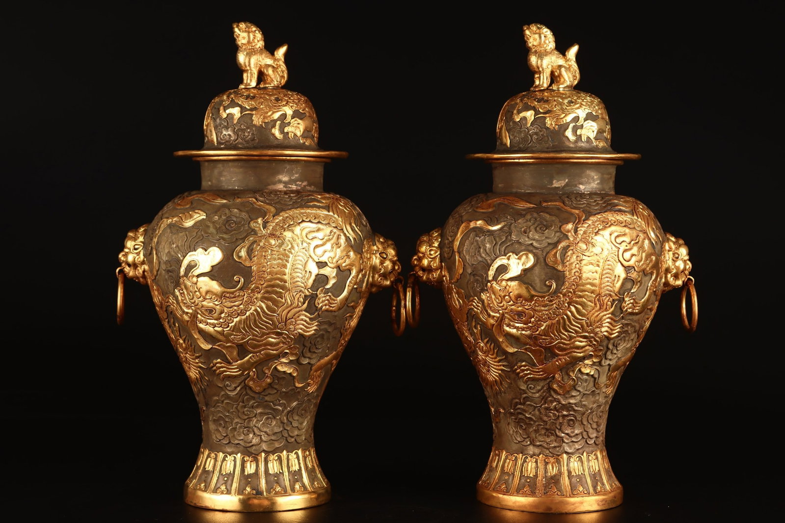 A Pair of Exquisite Gilt Bronze Auspicious Cloud and Lion Pattern Beast-Ears Cover Jars: A Pair of Exquisite Gilt Bronze Auspicious Cloud and Lion Pattern Beast-Ears Cover Jars,Qing Dynasty,China,Qianlong Four-character Mark,Size:11inx5.9in,Total Weight:2978g