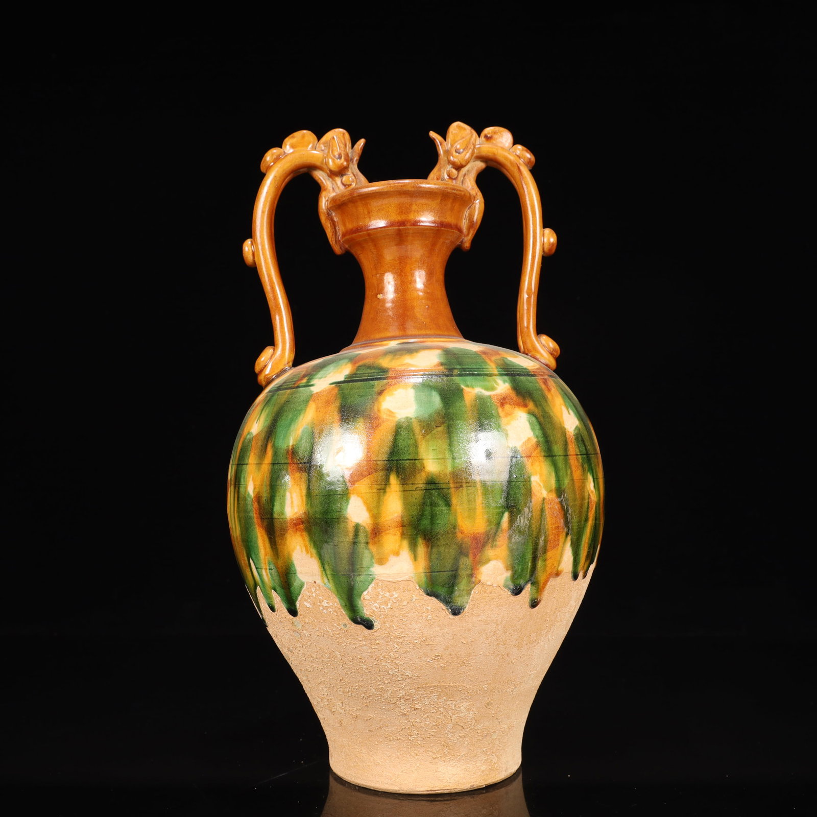 A Rare Tang Tri-Color Glazed Pottery Double Dragon Ears Vase: A Rare Tang Tri-Color Glazed Pottery Double Dragon Ears Vase,Tang Dynasty, China,Chinese Tang Tri-colored Pottery, or Tang Sancai, flourished during the Tang Dynasty (618–907 AD). It's renowned