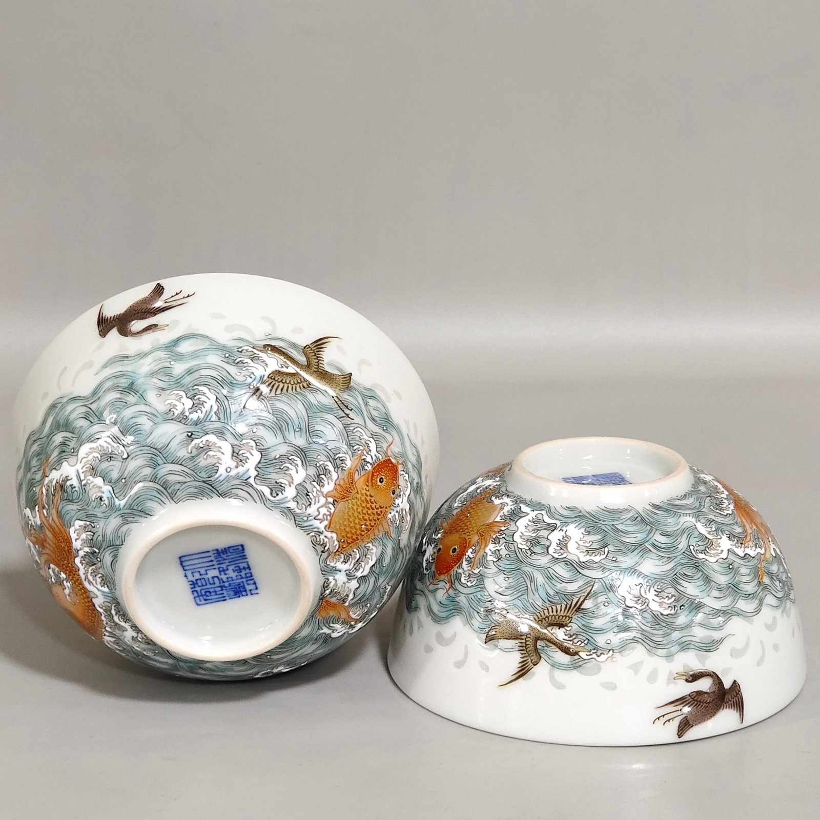 A Pair of Exquisite Famille-Rose Painted Gold Seawater Fish and Wild Goose Pattern Cups: A Pair of Exquisite Famille-Rose Painted Gold Seawater Fish and Wild Goose Pattern Cups,Qing Dynasty,China,Qianlong Six-character Mark,Size:1.7inx3.4in 一对粉彩描金