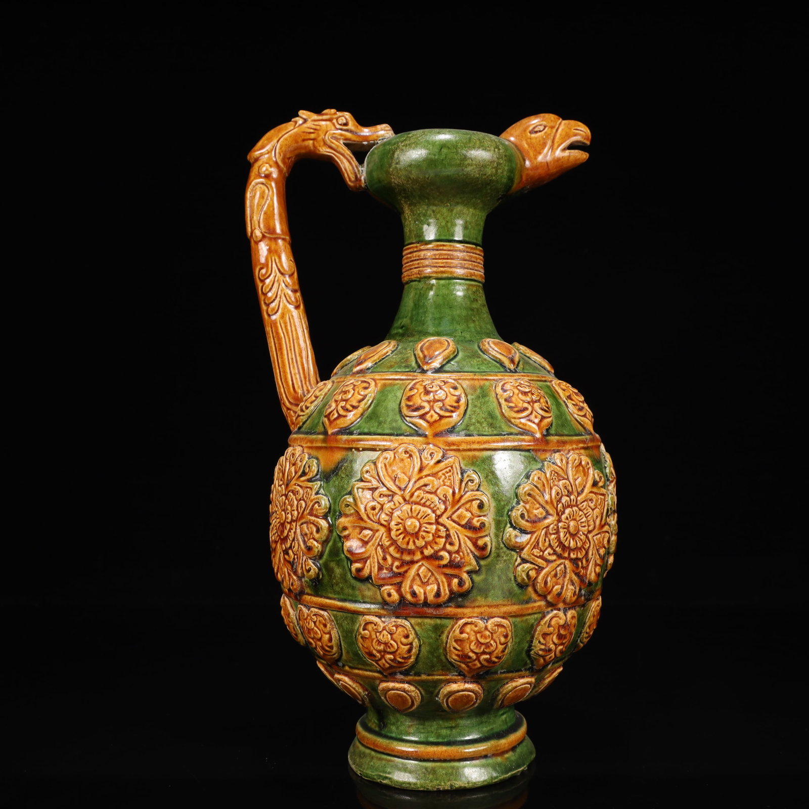 A Rare Tang Tri-Color Glazed Pottery Flower Pattern Dragon Handle Phoenix Head Ewer: A Rare Tang Tri-Color Glazed Pottery Flower Pattern Dragon Handle Phoenix Head Ewer,Tang Dynasty, China,Chinese Tang Tri-colored Pottery, or Tang Sancai, flourished during the Tang Dynasty (618–