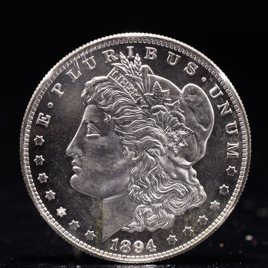 USA Morgan Dollar 1894 Coin: Obv: profile bust with date below and E PLURIBUS UNUM legend and stars around. Rev: eagle with In God we trust above within wreath with UNITED STATES OF AMERICA ONE DOLLAR legend. IN GOD WE TRUST / LI