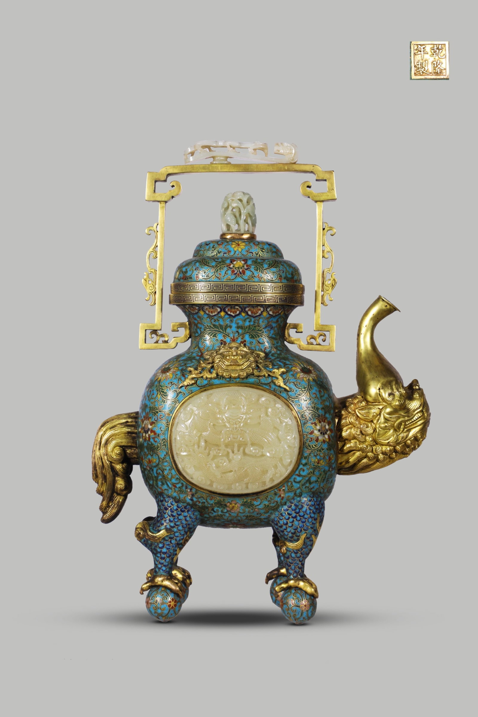 An Exquisite Cloisonne Inlaid White Jade Lotus Pattern Ewer: An Exquisite Cloisonne Inlaid White Jade Lotus Pattern Ewer,Qing Dynasty,China,Qianlong Four-character Mark,Size:15.7inx11.8in,Weight:4450g 景泰蓝嵌白玉缠