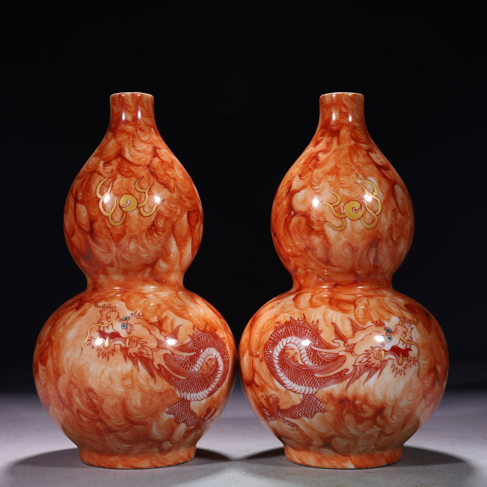 A Pair of Exquisite Iron-Red Auspicious Cloud and Dragon Pattern Gourd-Shaped Vases: A Pair of Exquisite Iron-Red Auspicious Cloud and Dragon Pattern Gourd-Shaped Vases,Qing Dynasty,China,Qianlong Four-character Mark,Size:4.3inx8.7in,Weight:1100g