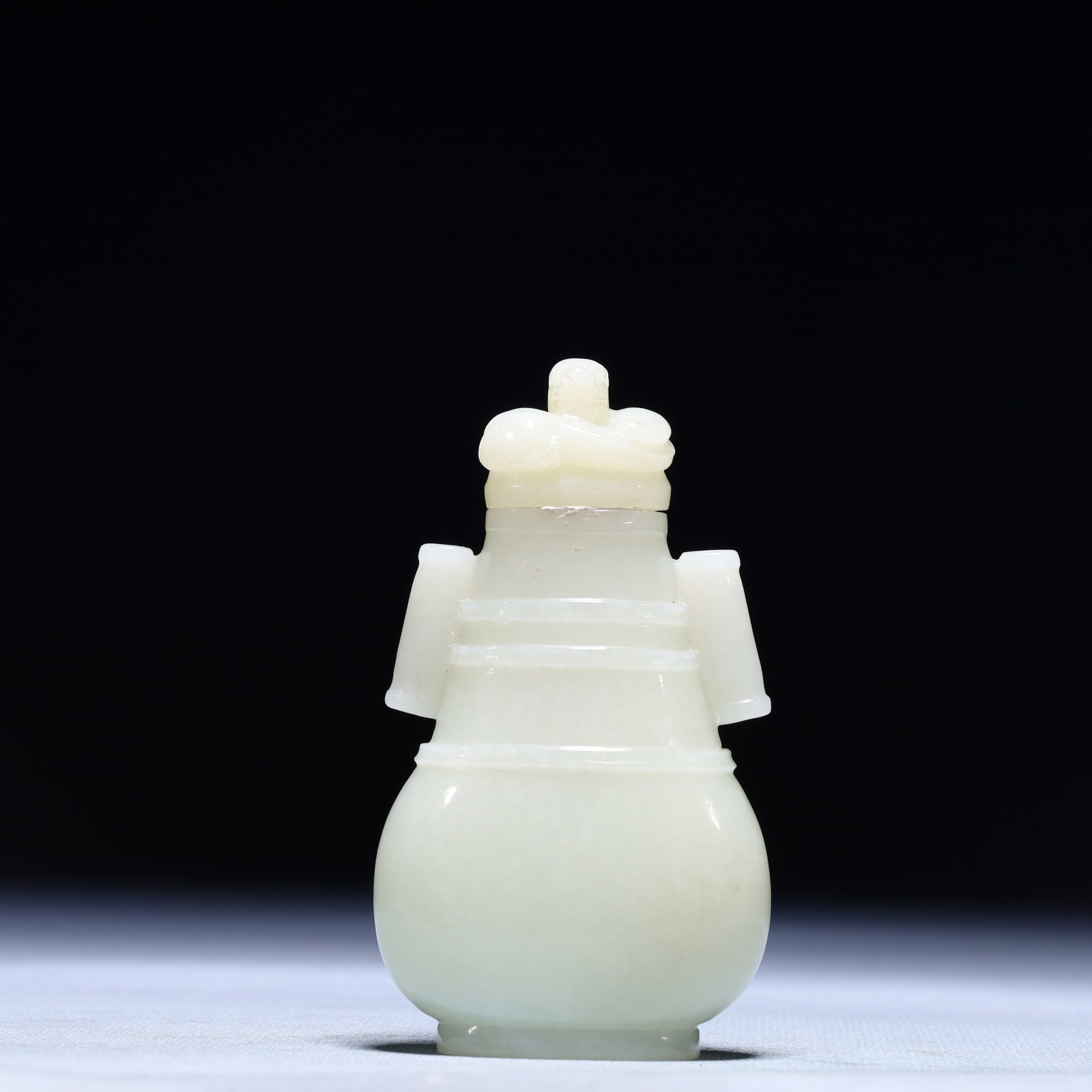 An Exquisite White Jade Double-Ears Bottle: An Exquisite White Jade Double-Ears Bottle,Qing Dynasty,China,Size:2inx0.8inx3in,Weight:122.3g 白玉双耳盖瓶,中国清代