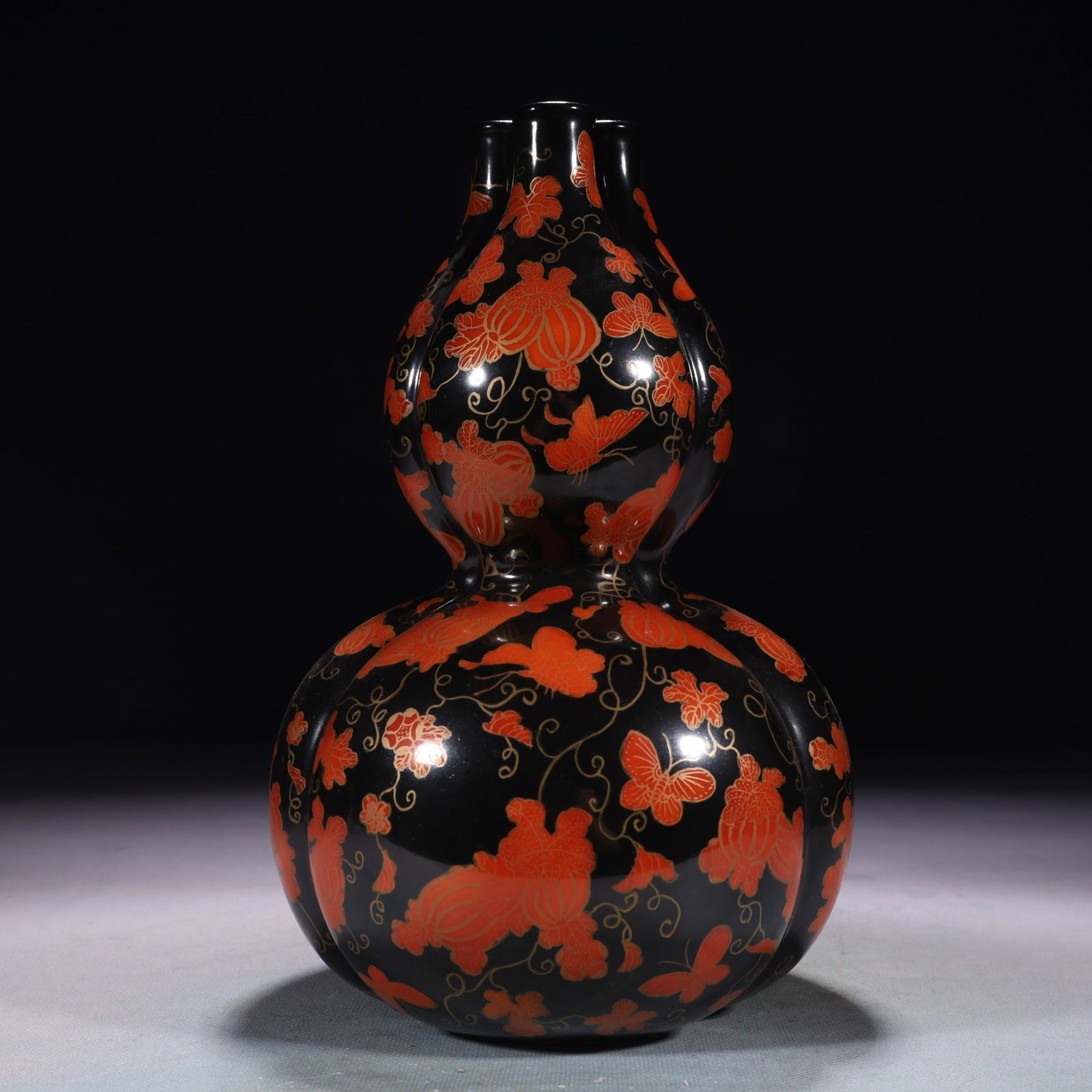 An Exquisite Iron-Red Painted Gold Melon and Fruit Pattern Gourd-Shaped Vase: An Exquisite Iron-Red Painted Gold Melon and Fruit Pattern Gourd-Shaped Vase,Qing Dynasty,China,Qianlong Six-character Mark,Size:5.9inx10.2in,Weight:1250g 矾红描金瓜ĉ