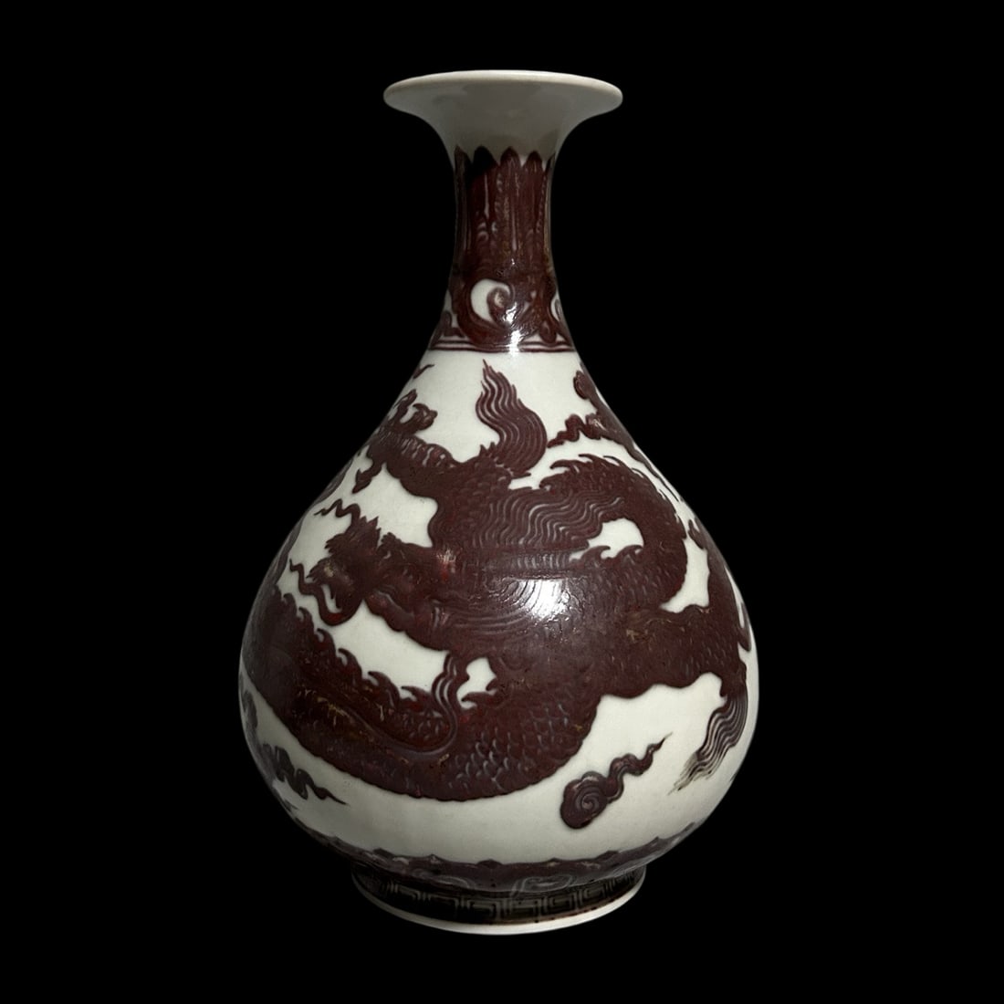 An Exquisite Underglaze-Red Auspicious Cloud and Dragon Pattern Vase: An Exquisite Underglaze-Red Auspicious Cloud and Dragon Pattern Vase,Ming Dynasty,China,Xuande Six-character Mark,Size:10.5inx5.3in
