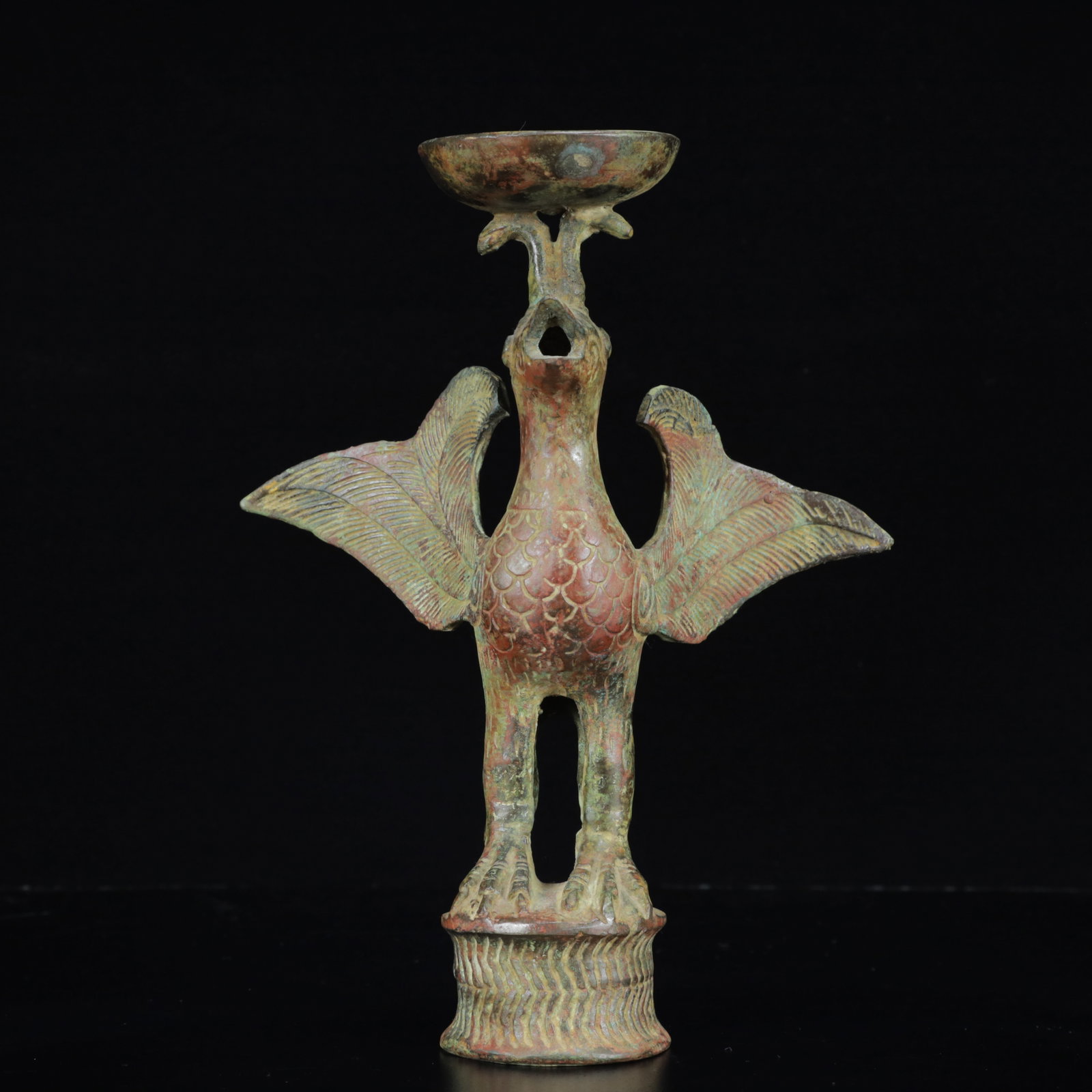 An Archaic Bronze Phoenix Candlestick: An Archaic Bronze Phoenix Candlestick,the Warring States Period in China,Size:7.9inx4.7inx5.9in,Weight:1200g 青铜凤烛台,中国战国时期