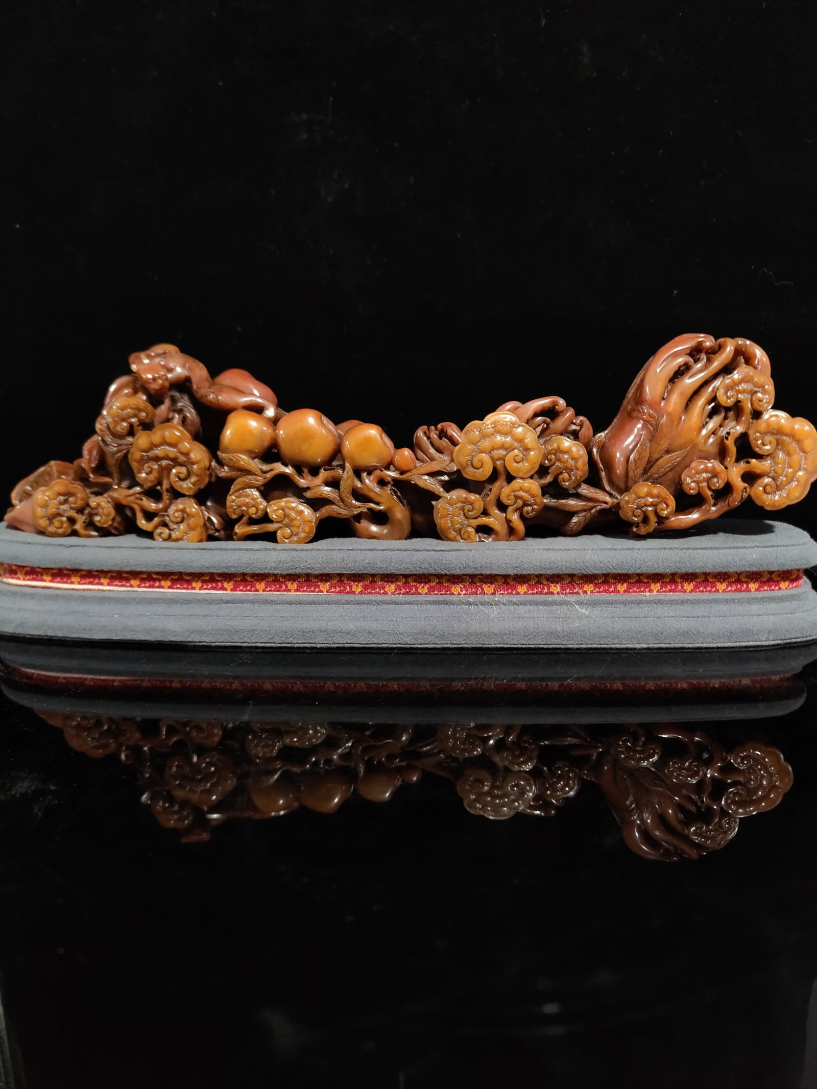 An Exquisite Tianhuang Stone Ruyi Ornament: An Exquisite Tianhuang Stone Ruyi Ornament,Qing Dynasty,China,Size:3.3inx5.5in,Weight:1071g 田黄石如意摆件,中国清代