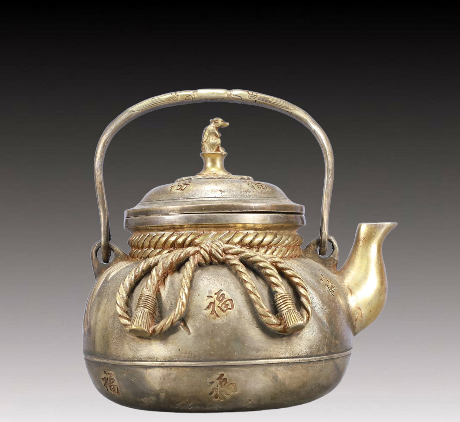 A Rare Gilt Silver Fu-Character Pattern Teapot: A Rare Gilt Silver Fu-Character Pattern Teapot,Qing Dynasty, China,Qianlong Four-character Mark,Size:7.5inx5.9inx7.1in,Weight:1550g