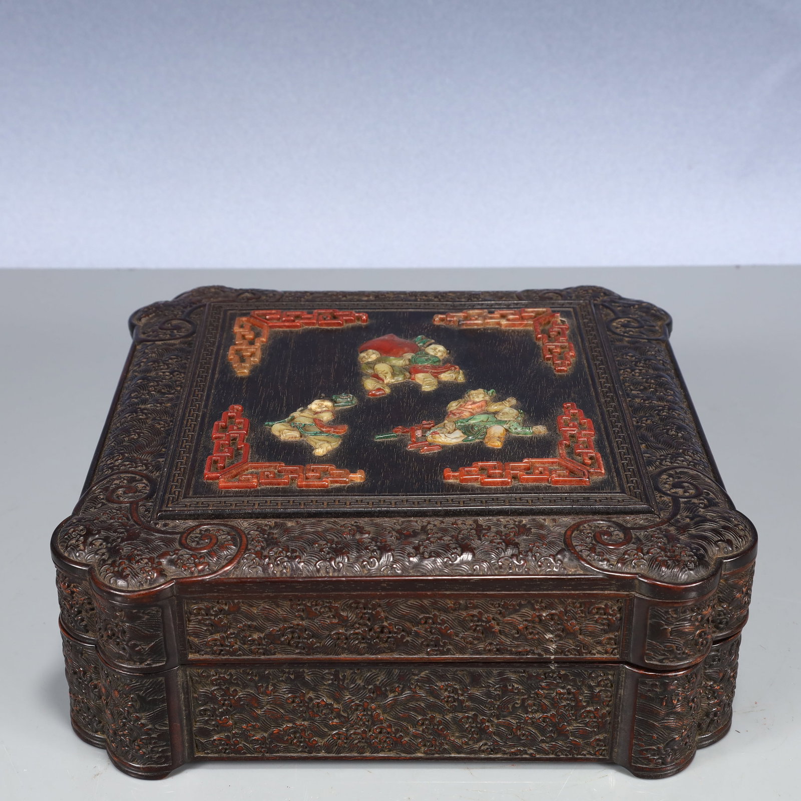 An Exquisite Zitanwood Seawater and Figure Pattern Cover Box,Inlaid Gems,With Poem: An Exquisite Zitanwood Seawater and Figure Pattern Cover Box,Inlaid Gems,With Poem,Qing Dynasty, China,Qianlong Six-character Mark,Size:9.8inx3.3in,Weight:1450g 紫檀木海水
