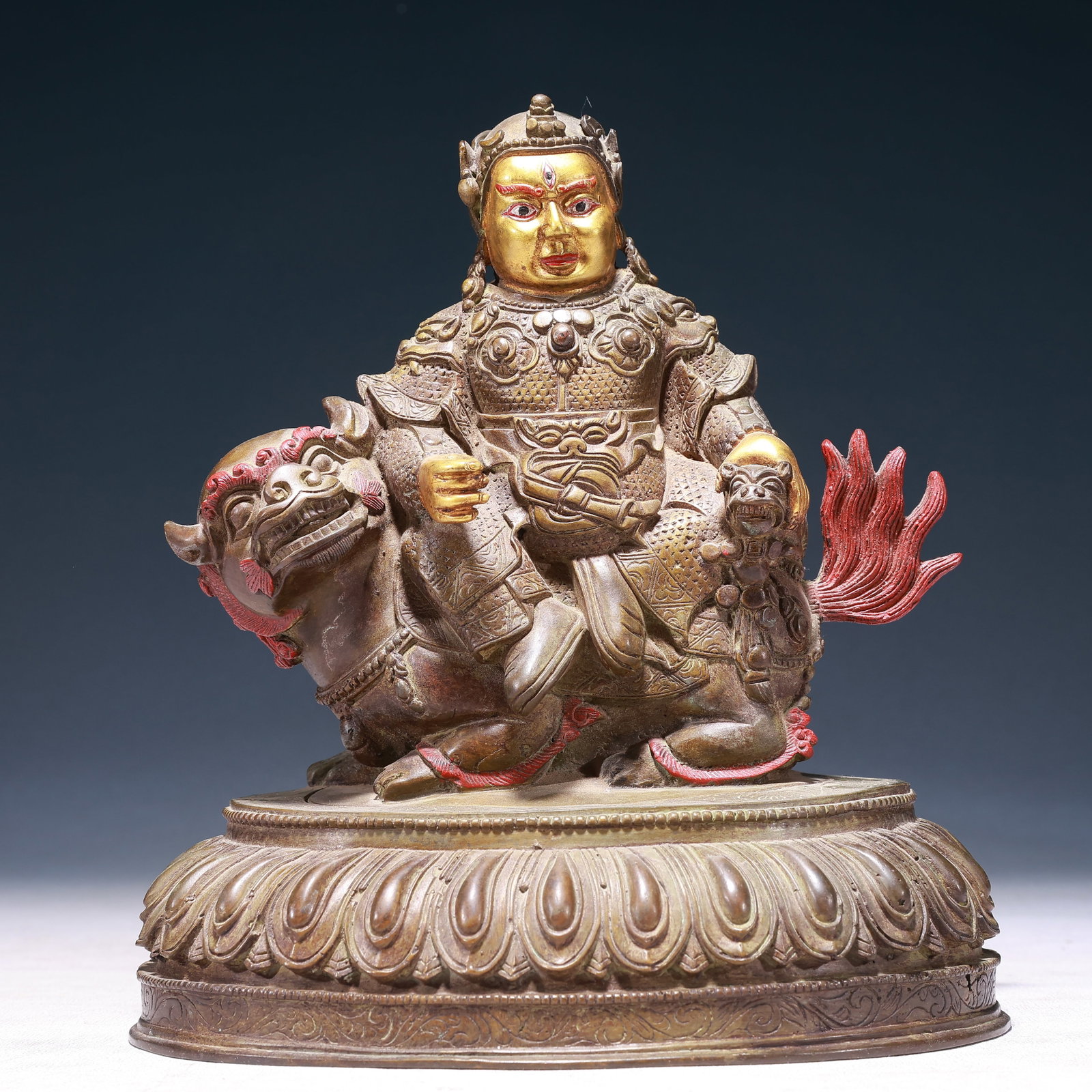 A Solemn Gilt Bronze Statue of Heavenly King Rides the Lion: A Solemn Gilt Bronze Statue of Heavenly King Rides the Lion,Qing Dynasty,China,Size:7.9inx5.1inx9.1in,Weight:2450g 铜鎏金骑狮天王像,中国