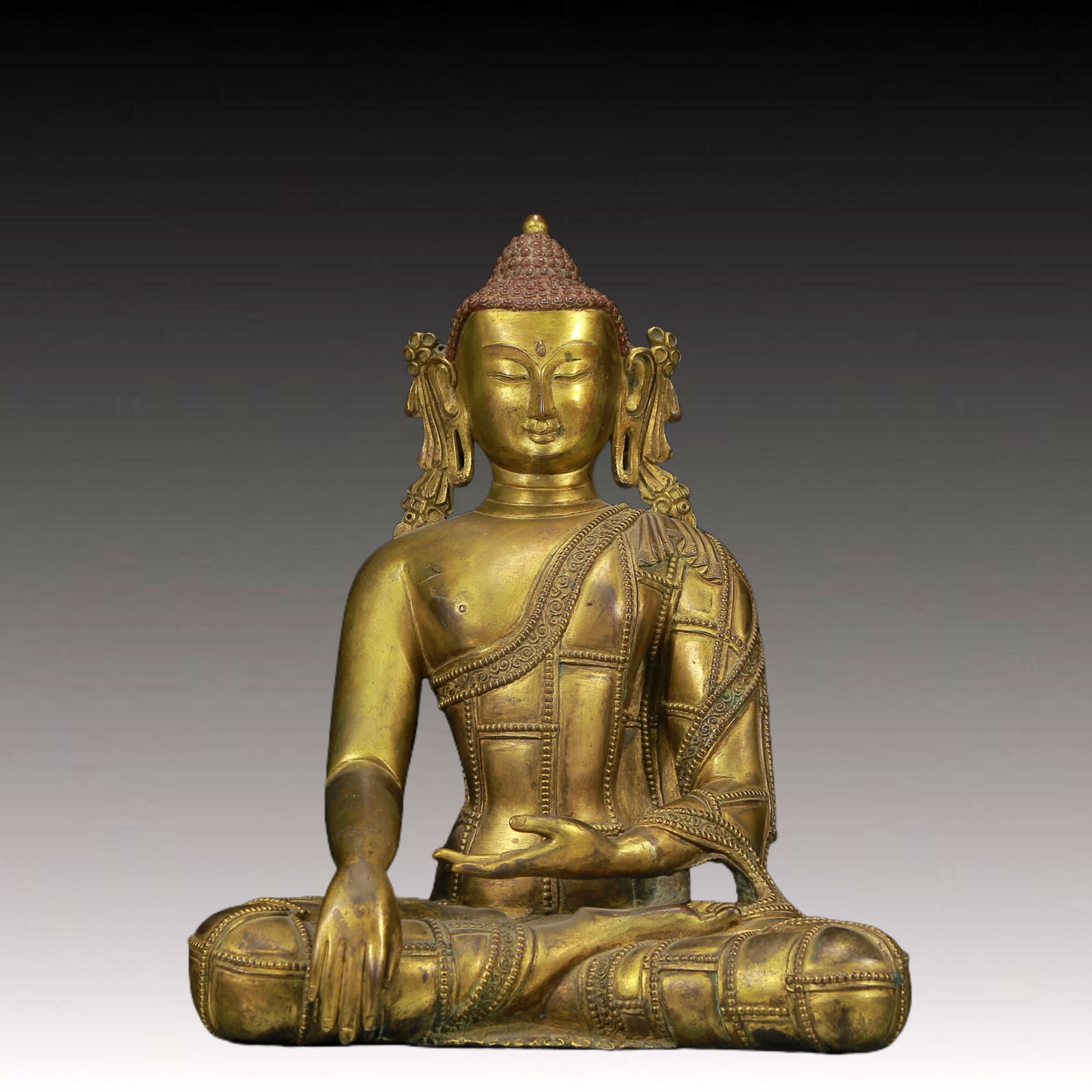 A Solemn Gilt Bronze Statue of Sakyamuni: A Solemn Gilt Bronze Statue of Sakyamuni ,Ming Dynasty, China,Size: 9.8inx5.9inx13in,Weight:6205g 铜鎏金释迦摩尼像，明代
