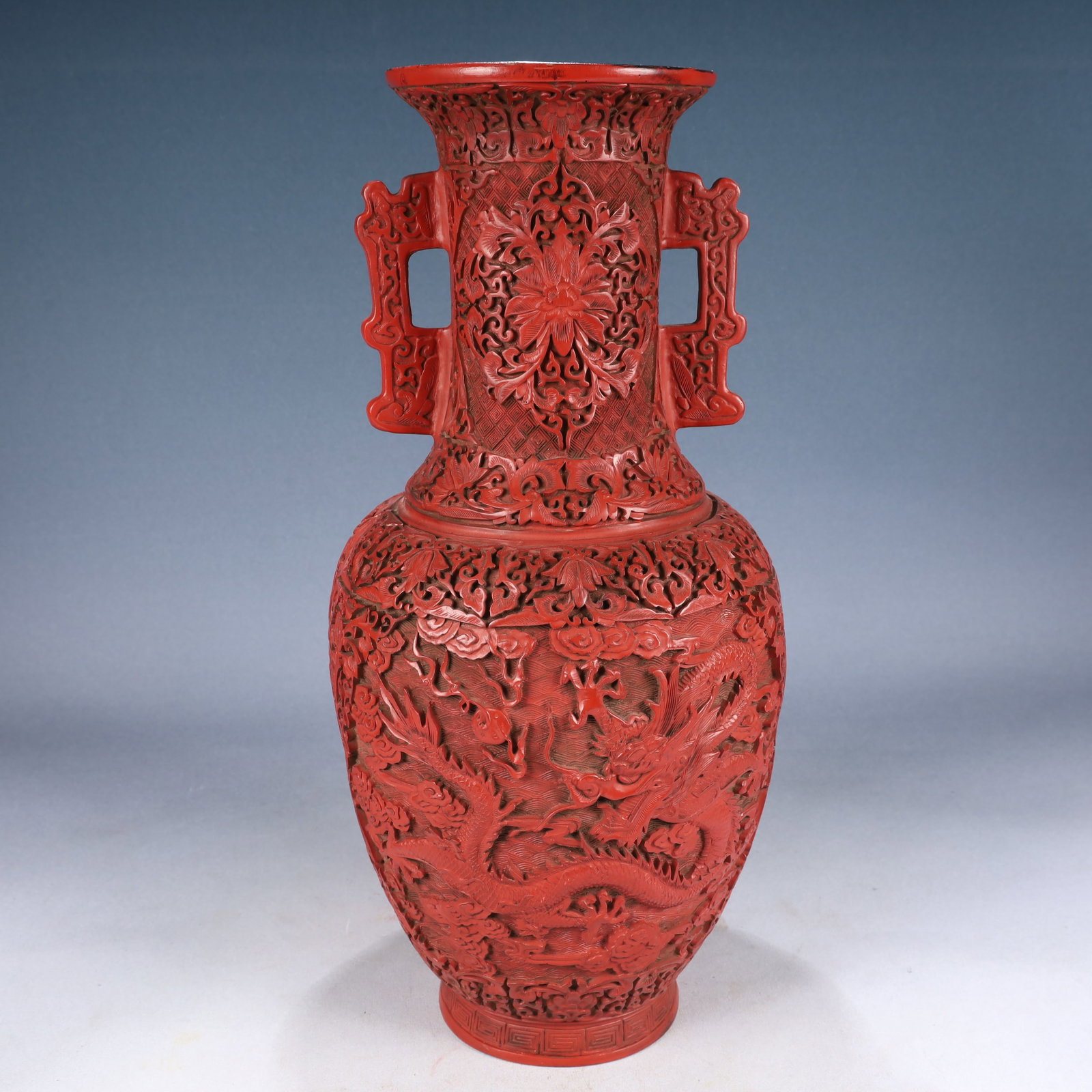 A Huge Carved Red Lacquer Auspicious Cloud and Dragon Pattern Double-Ears Vase: A Huge Carved Red Lacquer Auspicious Cloud and Dragon Pattern Double-Ears Vase,Qing Dynasty, China,Qianlong Six-character Mark,Size:7.5inx17.7in,Weight:2800g 剔红漆祥云&#