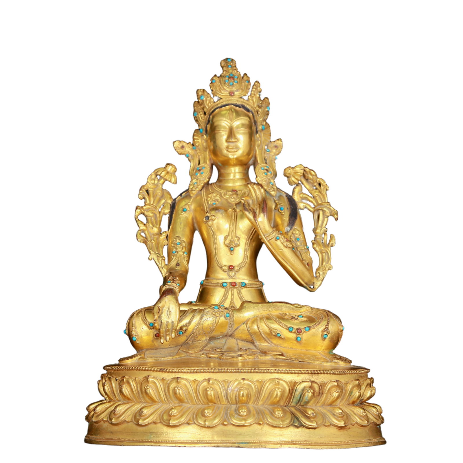 A stunning gilt bronze statue of Guanyin inlaid with precious stones: stunning gilt bronze statue of Tara inlaid with precious stones,Ming Dynasty, China, with an elegant posture and a peaceful and compassionate expression. Her face is soft and solemn, and her eyes are 