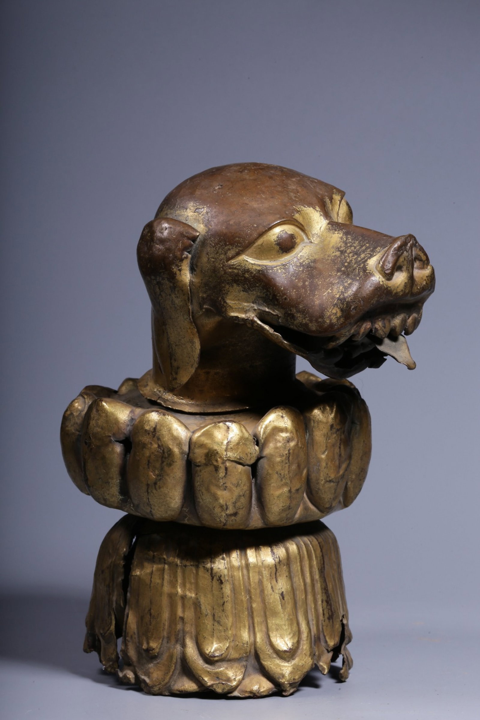 A Rare Gilt Bronze Dog's Head Ornament: A Rare Gilt Bronze Dog's Head Ornament,Qing Dynasty, China,Size:6.7inx4.3inx1.6in,Weight:511g 铜鎏金狗头摆件,中国清代
