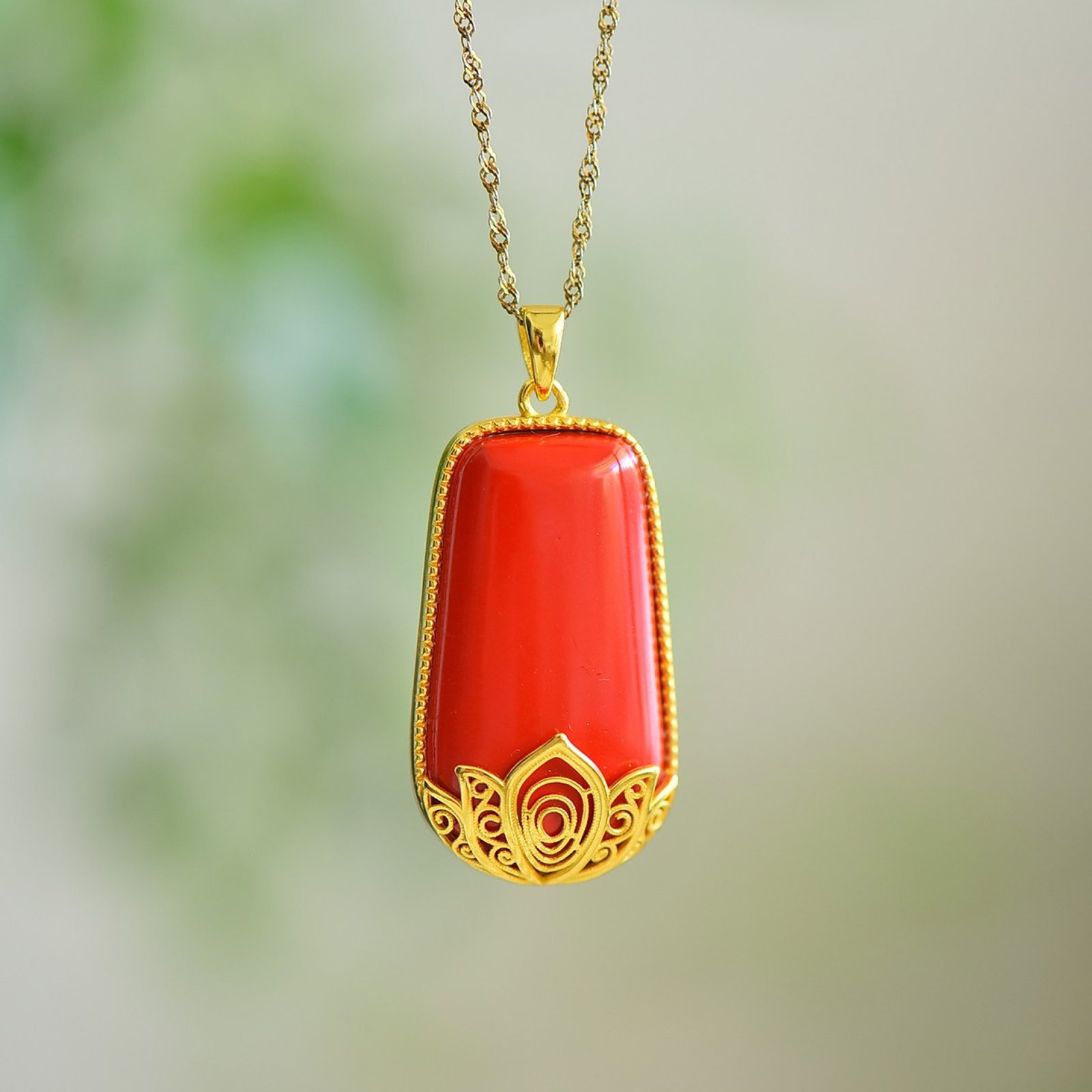 An Exquisite Sterling Silver-Gold Plated Inlaid Cinnabar Pendant: An Exquisite Sterling Silver-Gold Plated Inlaid Cinnabar Pendant,Size:0.6inx1.2in 寓意:好运莲莲,莲开见佛
