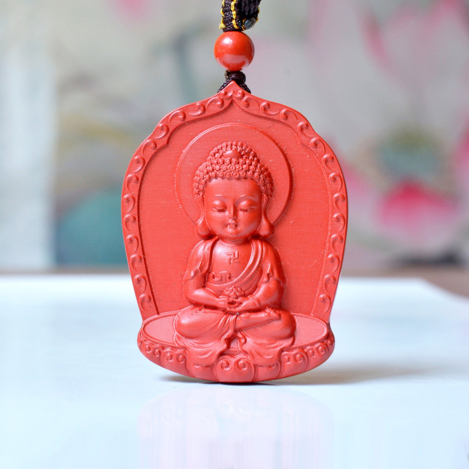 An Exquisite Cinnabar Pendant with Statue of Sakyamuni: An Exquisite Cinnabar Pendant with Statue of Sakyamuni,Size:1.3inx1.7in,Weight:30.6g 朱砂挂件带释迦摩尼佛像