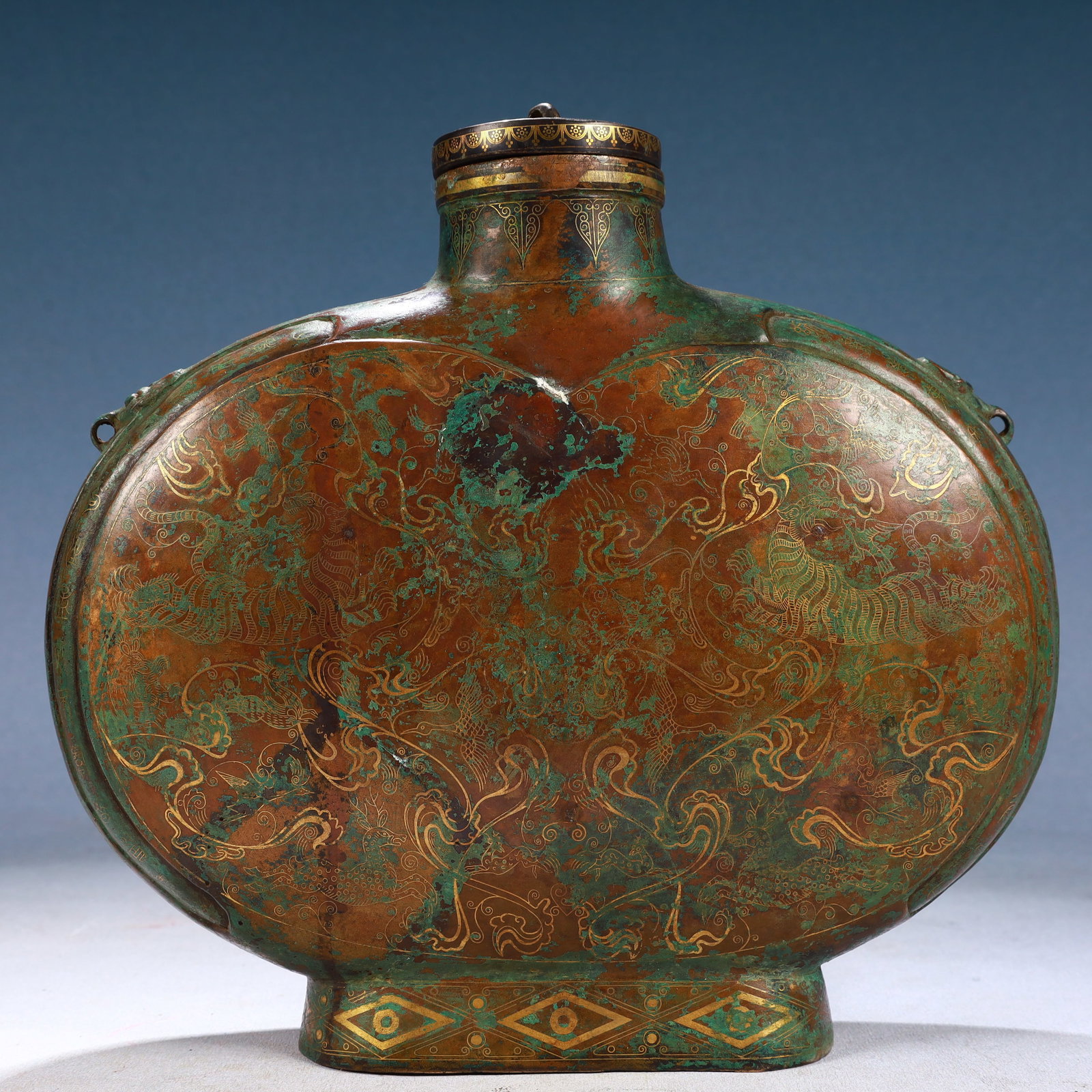 An Exquisite Bronze Inlaid Gold and Silver Auspicious Beast Pattern Beast-Ears Bottle: An Exquisite Bronze Inlaid Gold and Silver Auspicious Beast Pattern Beast-Ears Bottle,Qing Dynasty, China,Size:10.2inx2.8inx9.4in,Weight:3450g