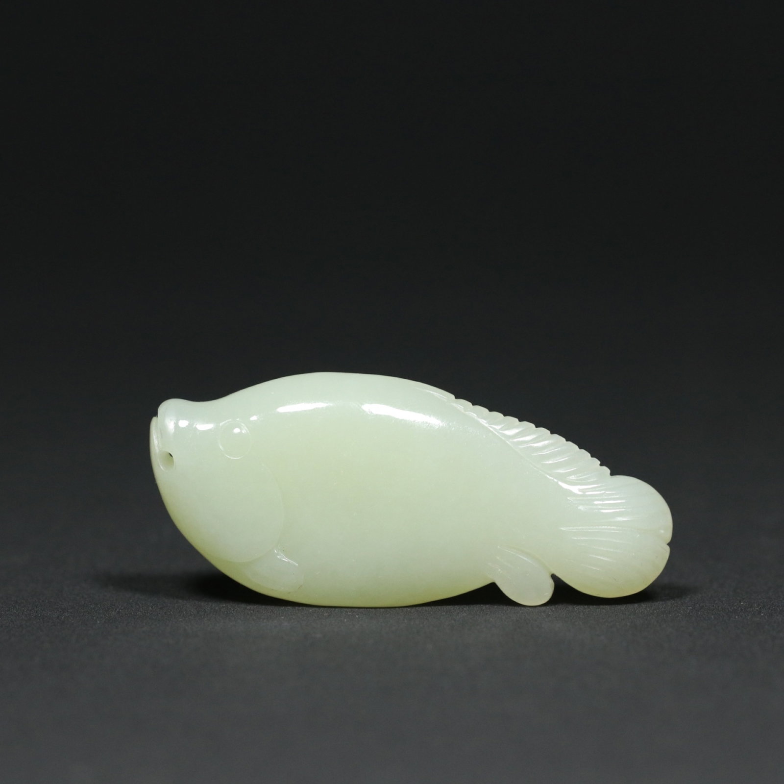An Exquisite White Jade Fish Ornament: An Exquisite White Jade Fish Ornament,Qing Dynasty,China,Size:2.6inx1.1inx0.5in,Weight:33.5g 白玉鱼摆件,中国清代