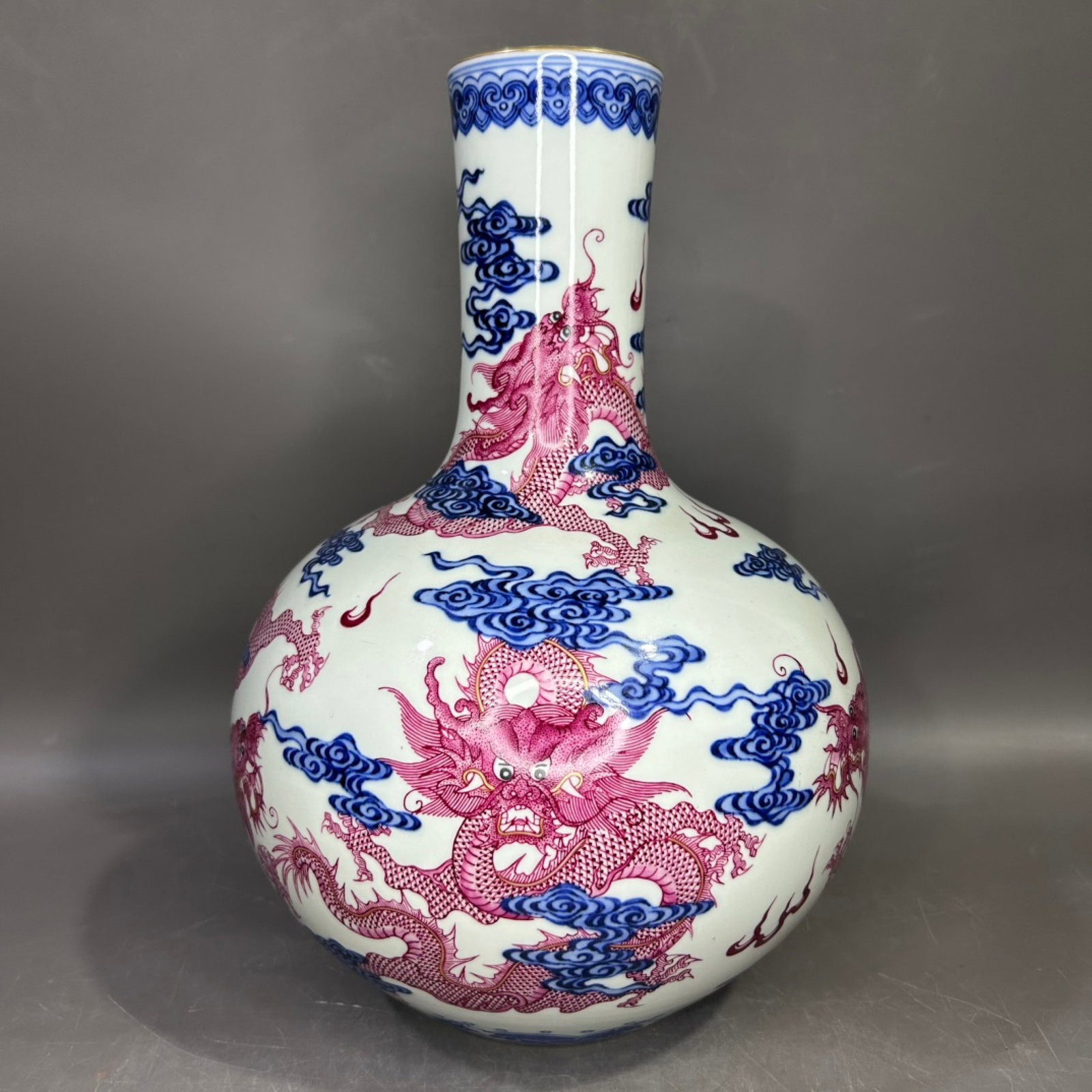 A Rare Blue and White Ruby Red-Glazed Painted Gold Auspicious Cloud and Dragon Pattern Vase: A Rare Blue and White Ruby Red-Glazed Painted Gold Auspicious Cloud and Dragon Pattern Vase,Qing Dynasty,China,Yongzheng Six-character Mark,Size:7.1inx12.6in