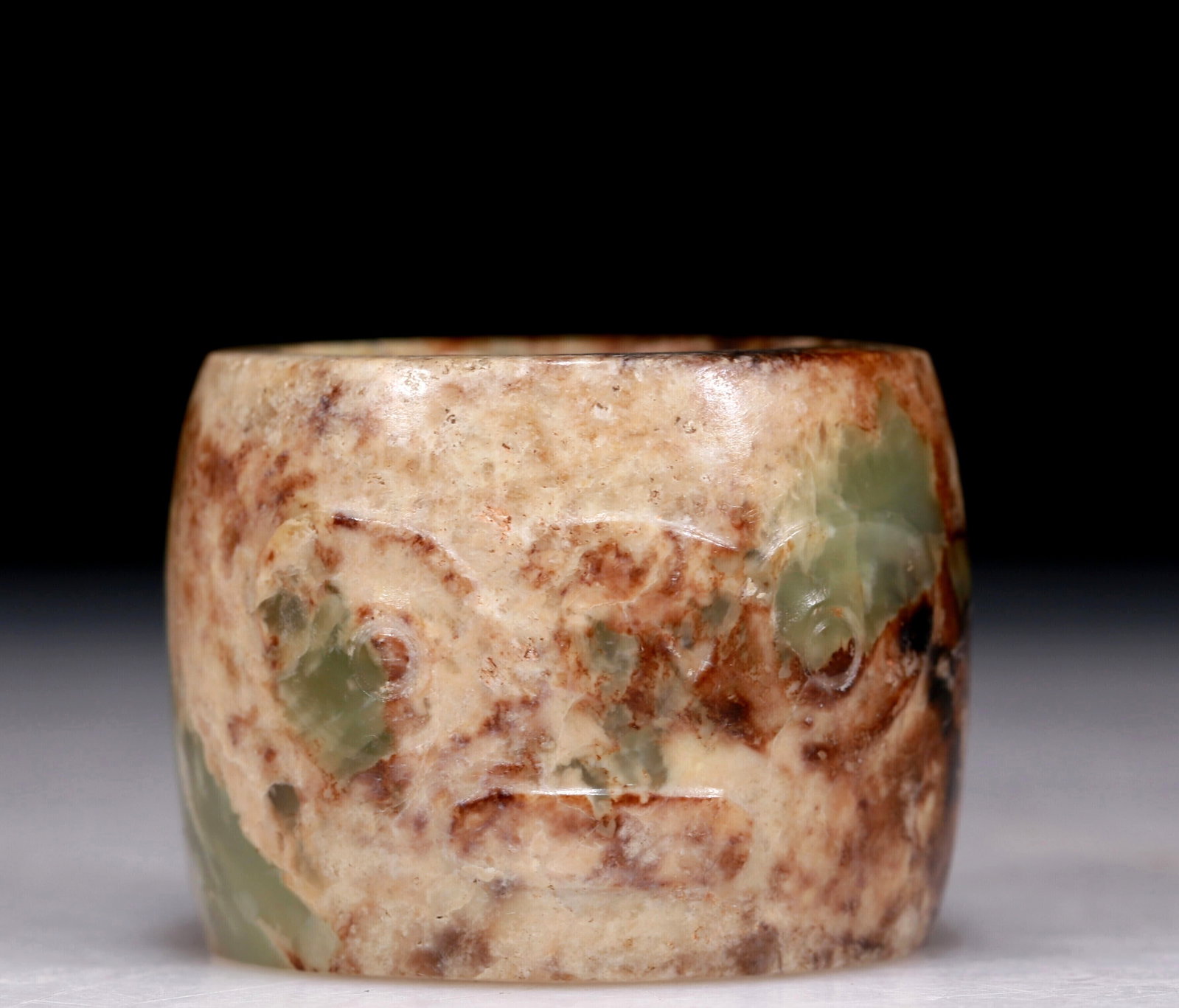 An Excellent Celadon Jade 'Animal Mask' Archer's Ring: An Excellent Celadon Jade 'Animal Mask' Archer's Ring. Chinese Qing Dynasty. Size:1.6inx1.2inx0.2in. Weight:68.6g 清代 青玉兽面纹扳指