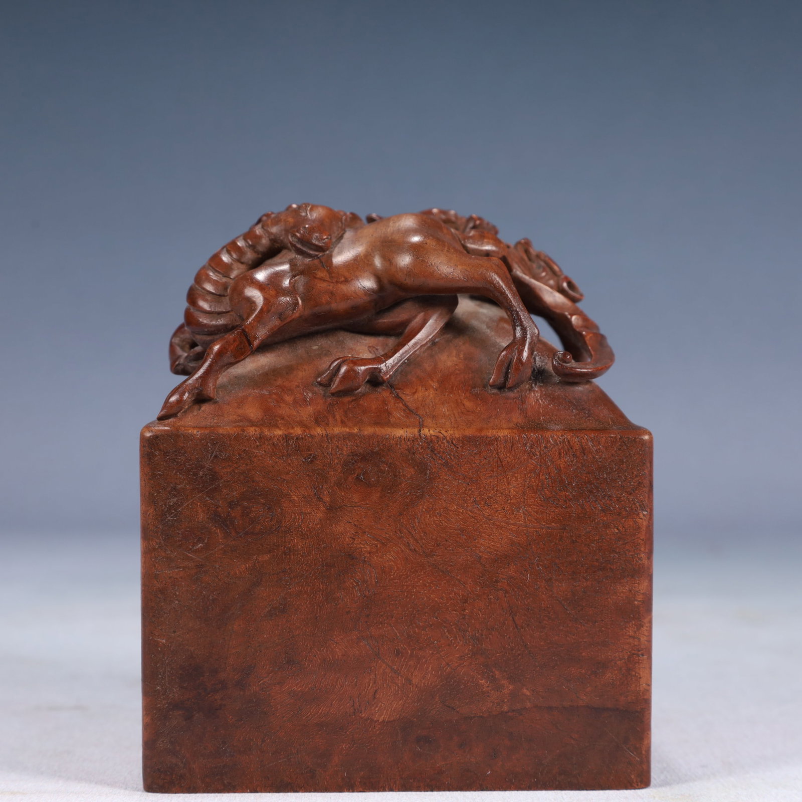 An Exquisite Huanghuali wood Auspicious Beast Pattern Seal: An Exquisite Huanghuali wood Auspicious Beast Pattern Seal,Qing Dynasty, China,Size:3.9inx4.5in,Weight:800g 黄花梨木瑞兽纹印章,中国