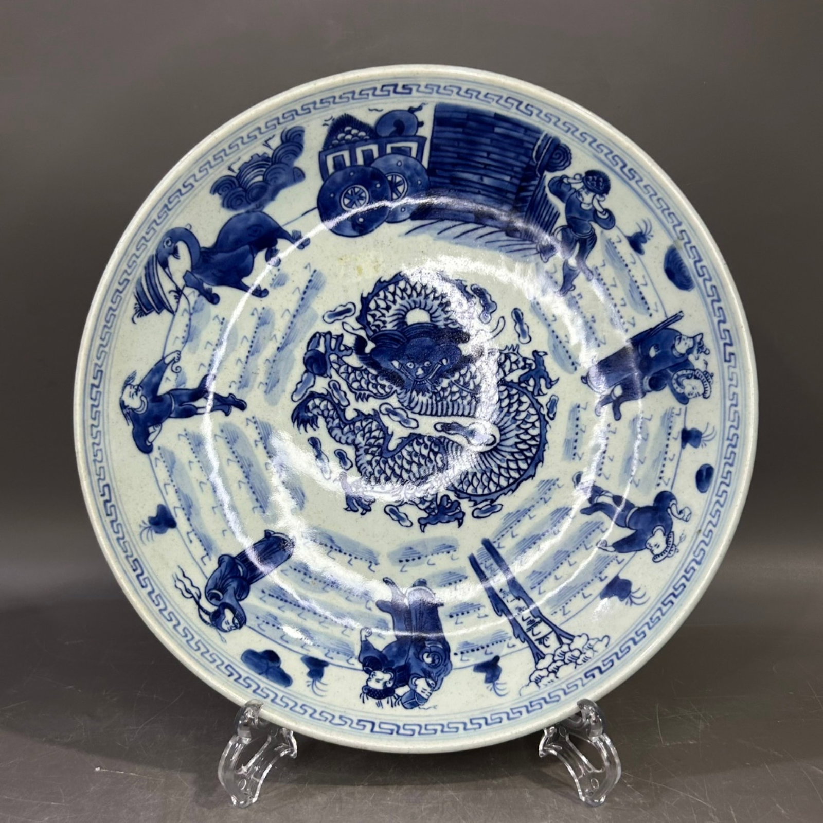 An Exquisite Blue and White Figure and Dragon Pattern Plate: An Exquisite Blue and White Figure and Dragon Pattern Plate,Qing Dynasty,China,Size:10.6inx2.4in 青花人物龙纹盘,中国清代