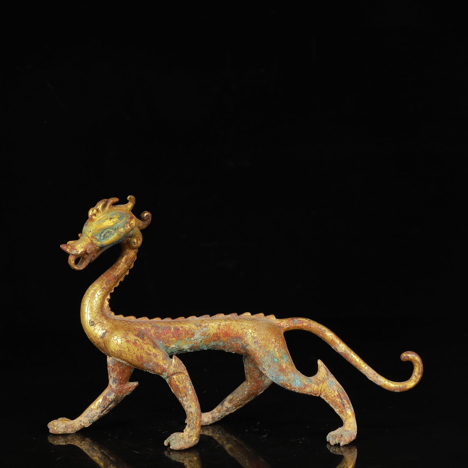 An Exquisite Gilt Bronze Dragon Ornament: An Exquisite Gilt Bronze Dragon Ornament,Qing Dynasty,China,Size:9.1inx2inx5.9in,Weight:700g 铜鎏金龙摆件,中国清代