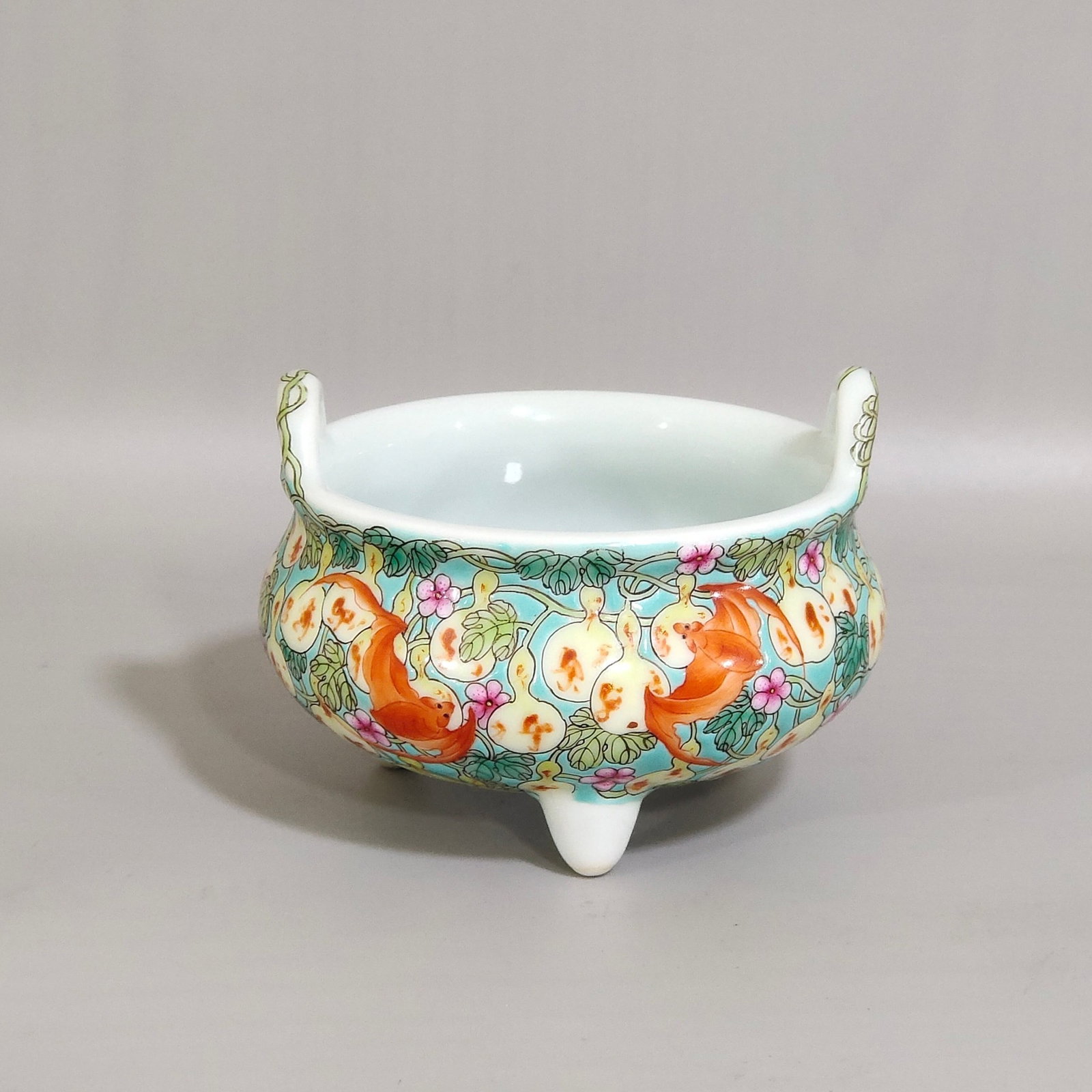 An Exquisite Famille-Rose Bats and Gourd Pattern Double-Ears Tripod Censer: An Exquisite Famille-Rose Bats and Gourd Pattern Double-Ears Tripod Censer,Qing Dynasty,China,Yongzheng Four-character Mark,Size:2.4inx3.3in