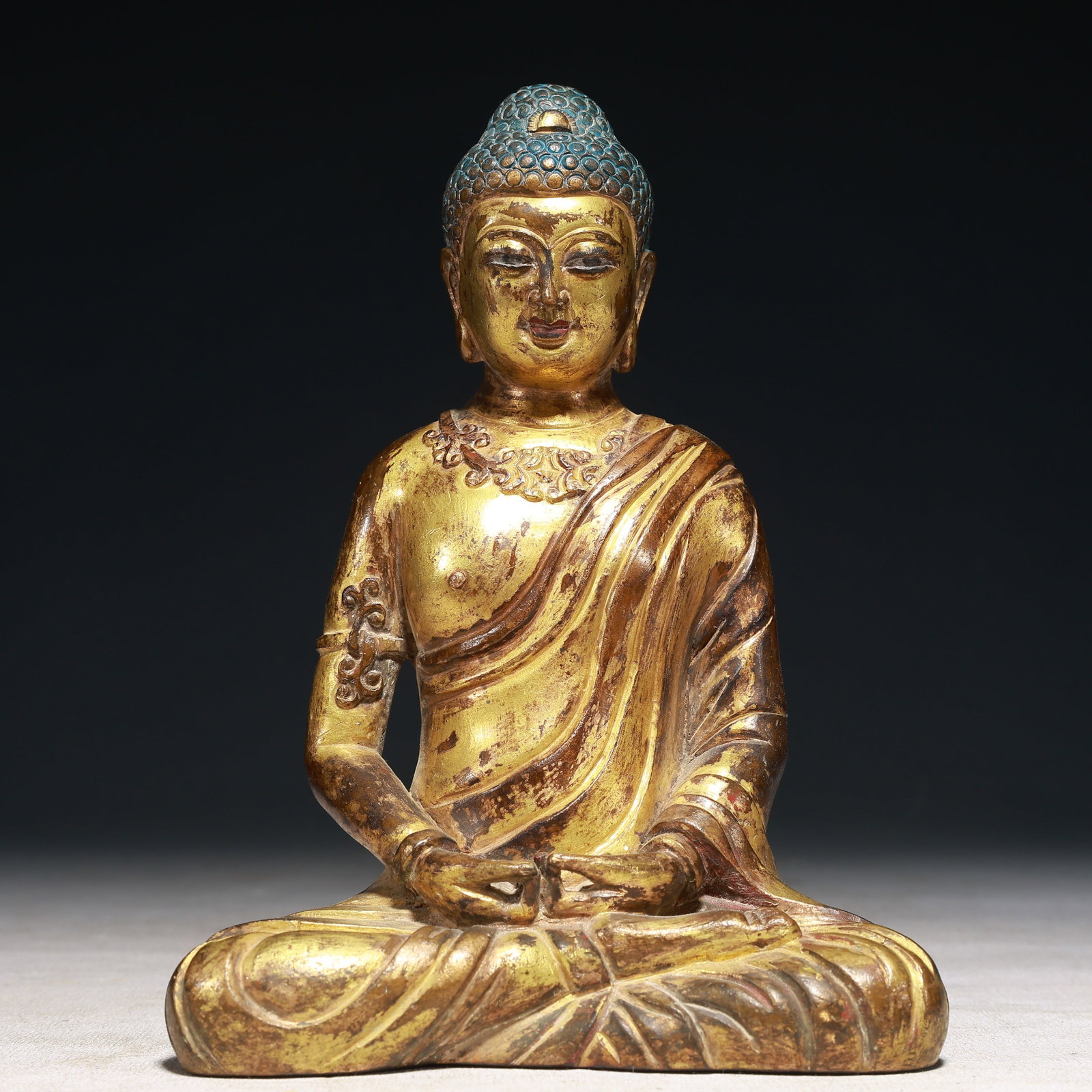 A Solemn Gilt Bronze Statue of Sakyamuni: A Solemn Gilt Bronze Statue of Sakyamuni,Qing Dynasty,China,Size:5.1inx2.8inx7.5in,Weight:1400g 铜鎏金如来像,中国清代