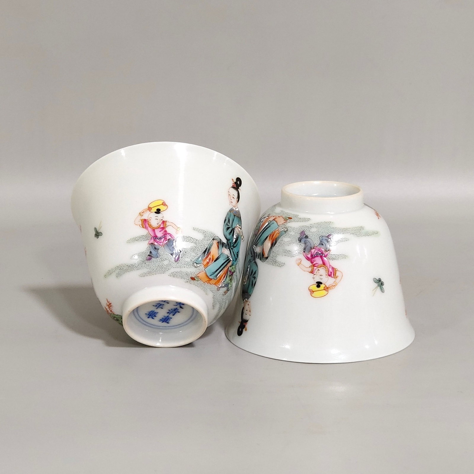 A Pair of Exquisite Famille-Rose Figure Pattern Cups: A Pair of Exquisite Famille-Rose Figure Pattern Cups,Qing Dynasty,China,Yongzheng Six-character Mark,Size:2inx2.6in 一对粉彩人物纹杯,中国