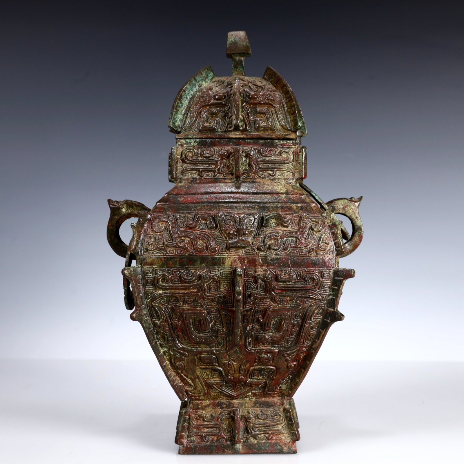A Rare Bronze Beast-Face Pattern Double-Ears Bottle: A Rare Bronze Beast-Face Pattern Double-Ears Bottle,W.Zhou,China,Size:7.5inx5.5inx11.4in,Weight:2800g 青铜兽面纹双耳瓶带盖,中国&