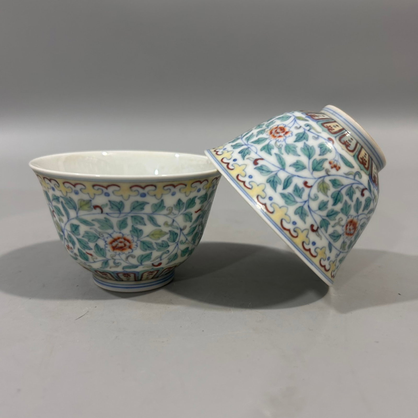 A Pair of Exquisite Doucai Lotus Pattern Cups: A Pair of Exquisite Doucai Lotus Pattern Cups,Qing Dynasty,China,Yongzheng Six-character Mark,Size:2.2inx3.1in