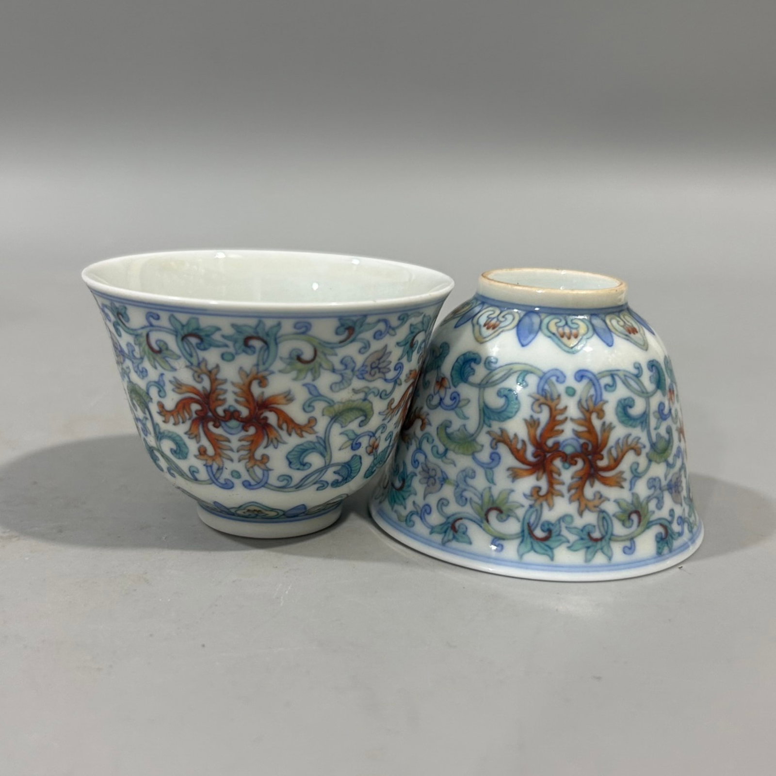 A Pair of Exquisite Doucai Lotus Pattern Cups: A Pair of Exquisite Doucai Lotus Pattern Cups,Qing Dynasty,China,Yongzheng Six-character Mark,Size:2inx2.8in