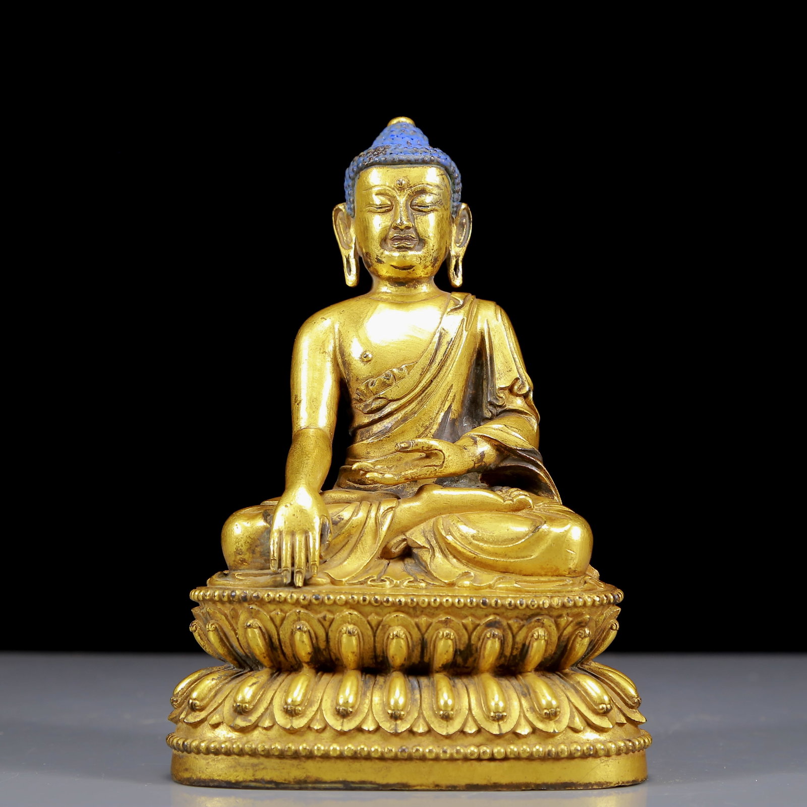 A Solemn Gilt Bronze Statue of Sakyamuni: A Solemn Gilt Bronze Statue of Sakyamuni,Ming Dynasty, China,Yongle Six-character Mark,Size:5.1inx3.3inx7.5in,Weight:1720g