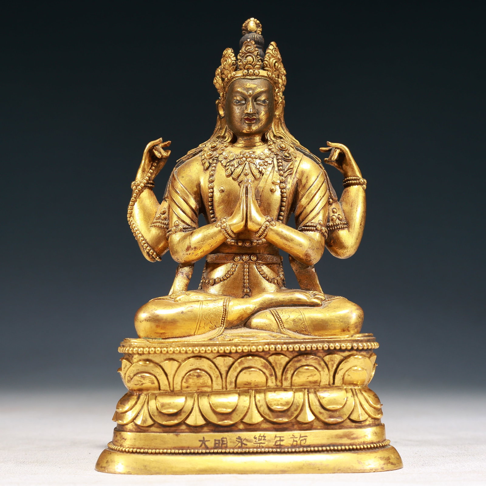 A Solemn Gilt Bronze Four-arms Buddha Statue,With Inscription: A Solemn Gilt Bronze Four-arms Buddha Statue,With Inscription,Ming Dynasty,China,Yongle Six-character Mark,Size:7.3inx4.5inx2.8in,Weight:1000g