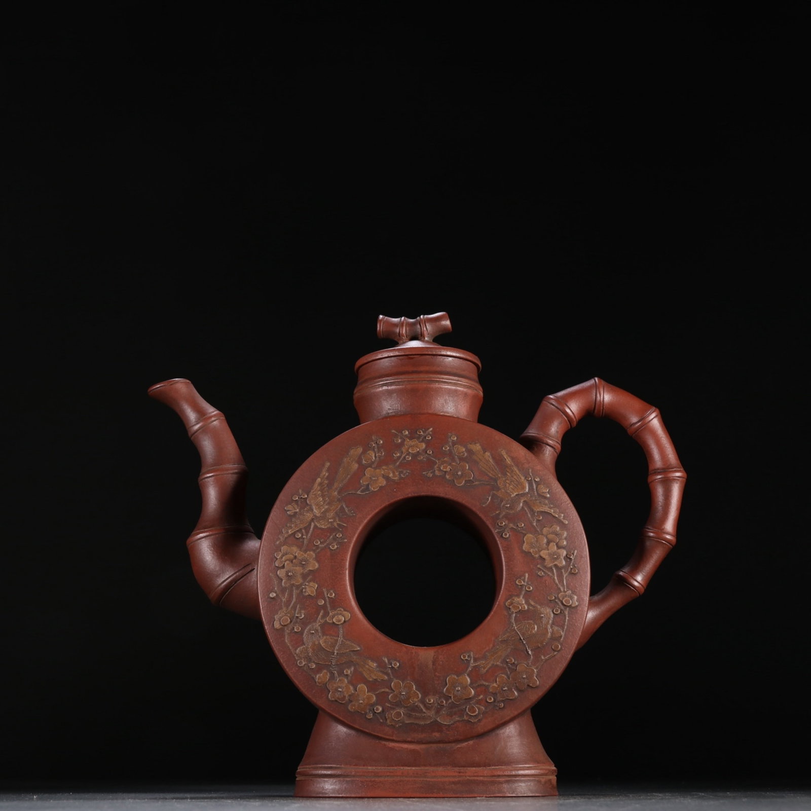 A Rare Purple Sands Flower and Bird Pattern Teapot: A Rare Purple Sands Flower and Bird Pattern Teapot,Qing Dynasty,China,Youquan Mark,Size:3.9inx8.1in 紫砂花鸟纹茶壶,中国清代,友&#