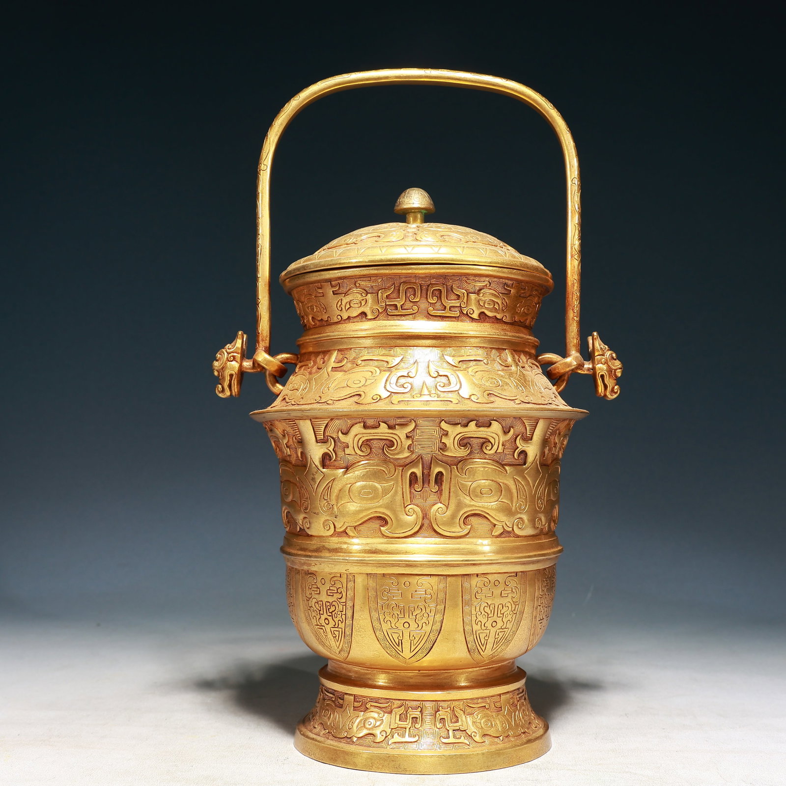 A Rare Gilt Bronze Beast-Face Pattern Beast-Ears Ewer: A Rare Gilt Bronze Beast-Face Pattern Beast-Ears Ewer,Qing Dynasty, China,Size:8.7inx7.1inx15in,Weight:2600g 铜鎏金兽面纹兽耳提壶,中&#