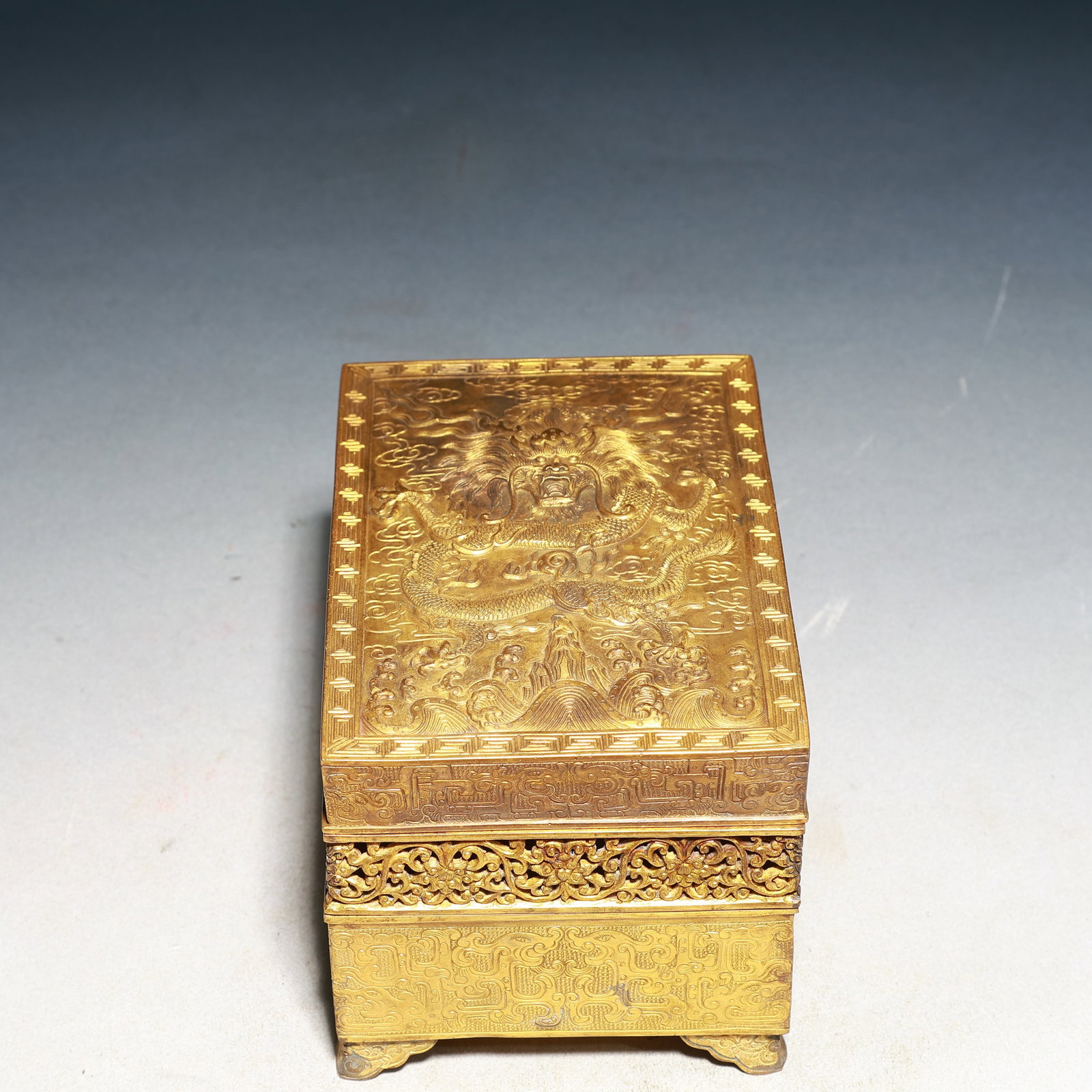 An Exquisite Gilt Bronze Auspicious Cloud and Dragon Pattern Hollow Box with Cover,With: An Exquisite Gilt Bronze Auspicious Cloud and Dragon Pattern Hollow Box with Cover,With Inkstone,With an Imperial Poem by Emperor Qianlong,Qing Dynasty,China,Qianlong Four-character Mark,Size:6.4inx4.