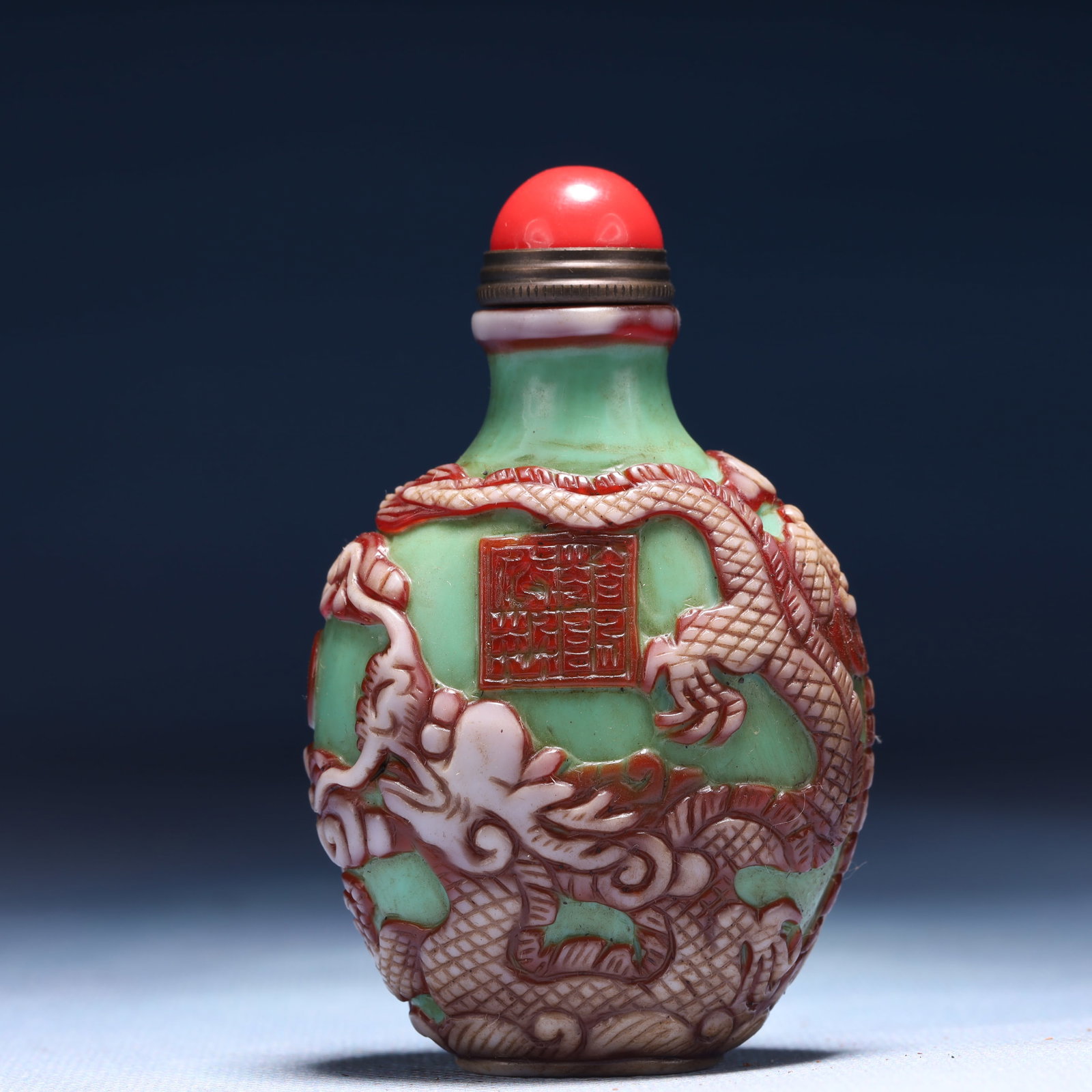 An Exquisite Glass Dragon and Phoenix Pattern Snuff Bottle: An Exquisite Glass Dragon and Phoenix Pattern Snuff Bottle,Qing Dynasty,China,Qianlong Four-character Mark,Size:2inx1.2inx3.1in,Weight:89g