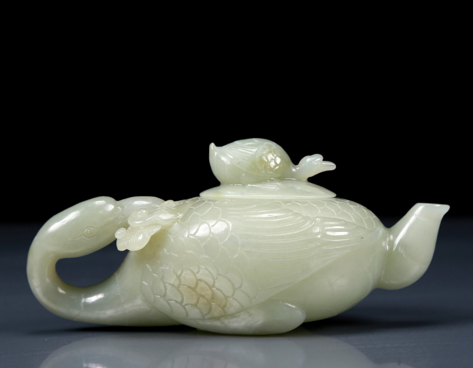 An Exquisite Greenish Jade Goose Teapot: An Exquisite Greenish Jade Goose Teapot ，Qing Dynasty, China，Size:4.7inx2.4inx2.2in，Weight:140g 青白玉鸭形茶壶，清代