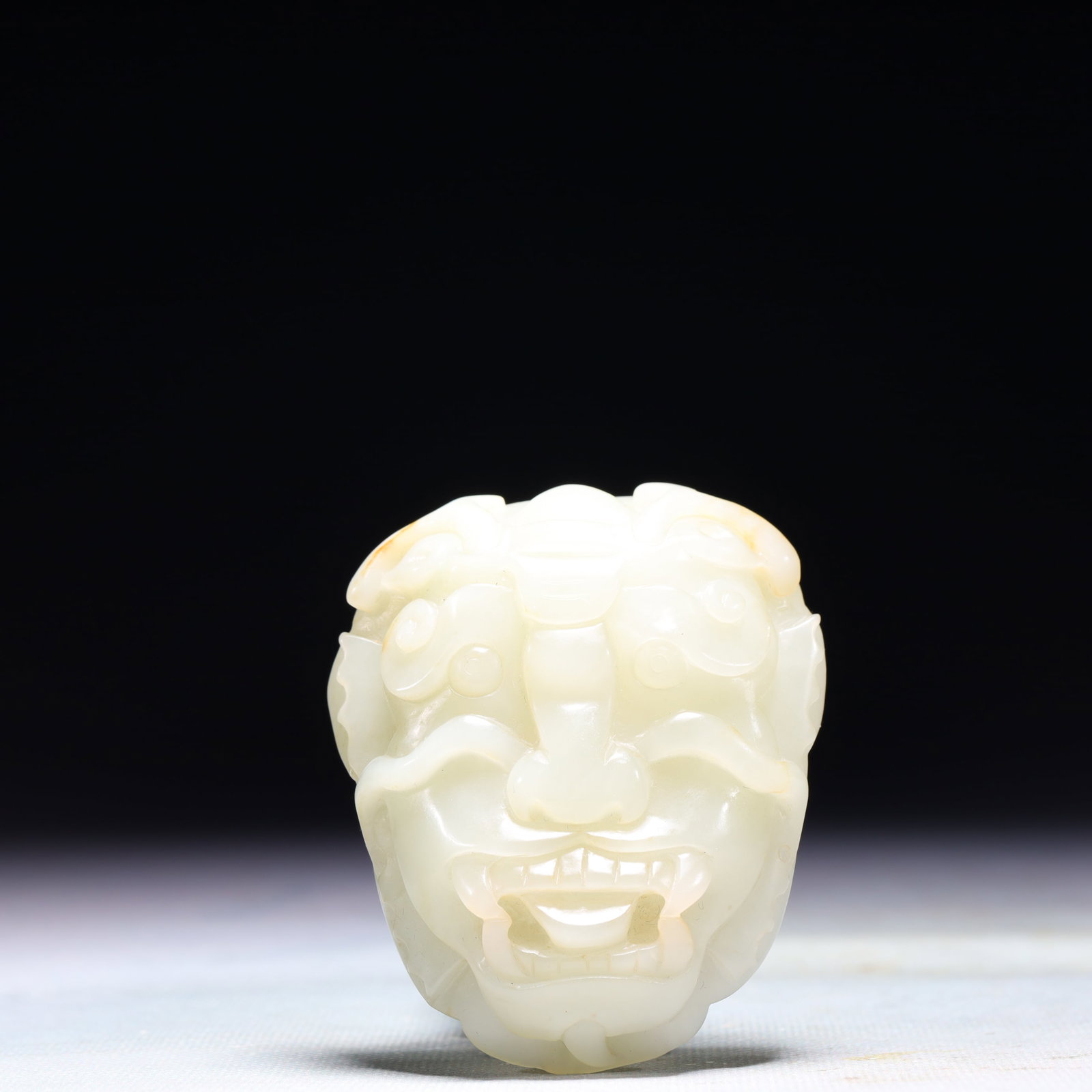 An Exquisite White Jade Beast-Face Pattern Buckle: An Exquisite White Jade Beast-Face Pattern Buckle,Qing Dynasty,China,Size:2.4inx0.6inx3in,Weight:108.2g