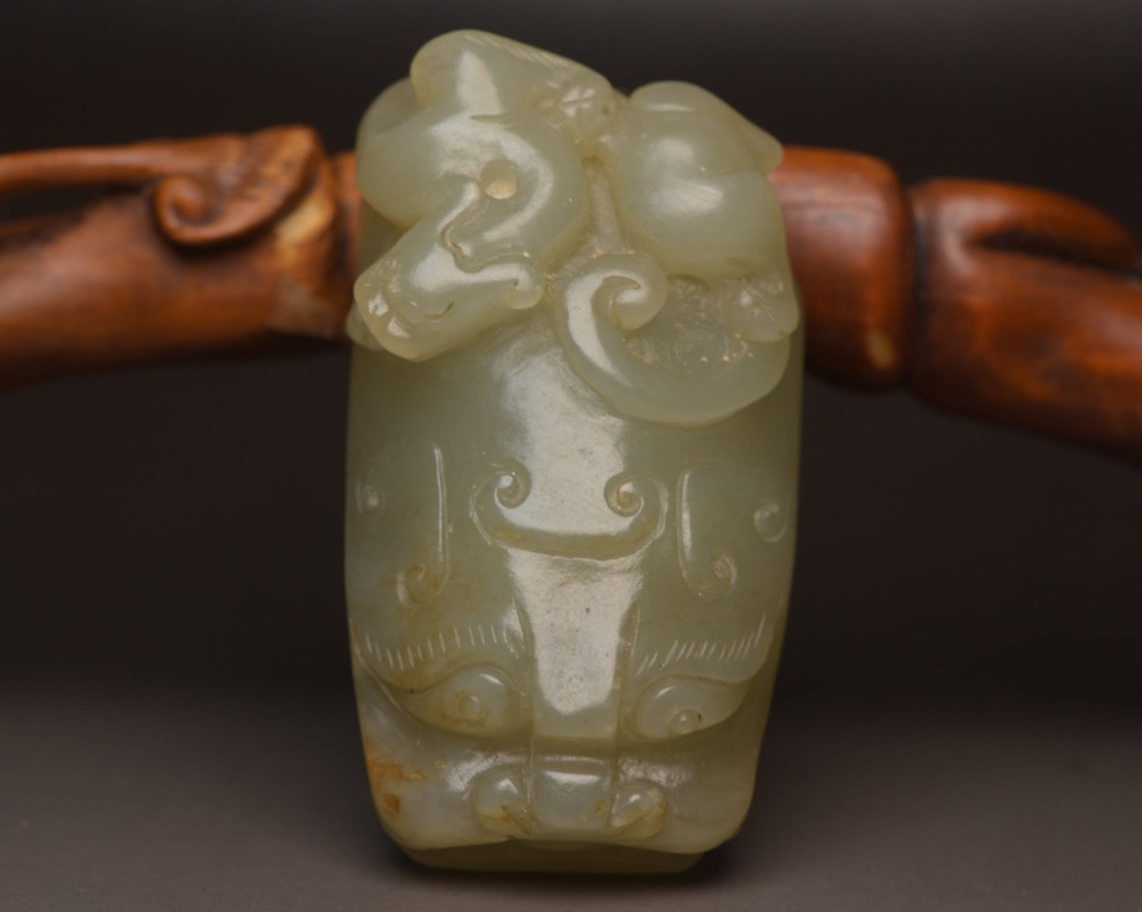 An Exquisite White Jade Beast-Face Pattern Pendant: An Exquisite White Jade Beast-Face Pattern Pendant,Qing Dynasty,China,Size:2.2inx1.3inx1in,Weight:71g 白玉兽面纹佩,中国清代