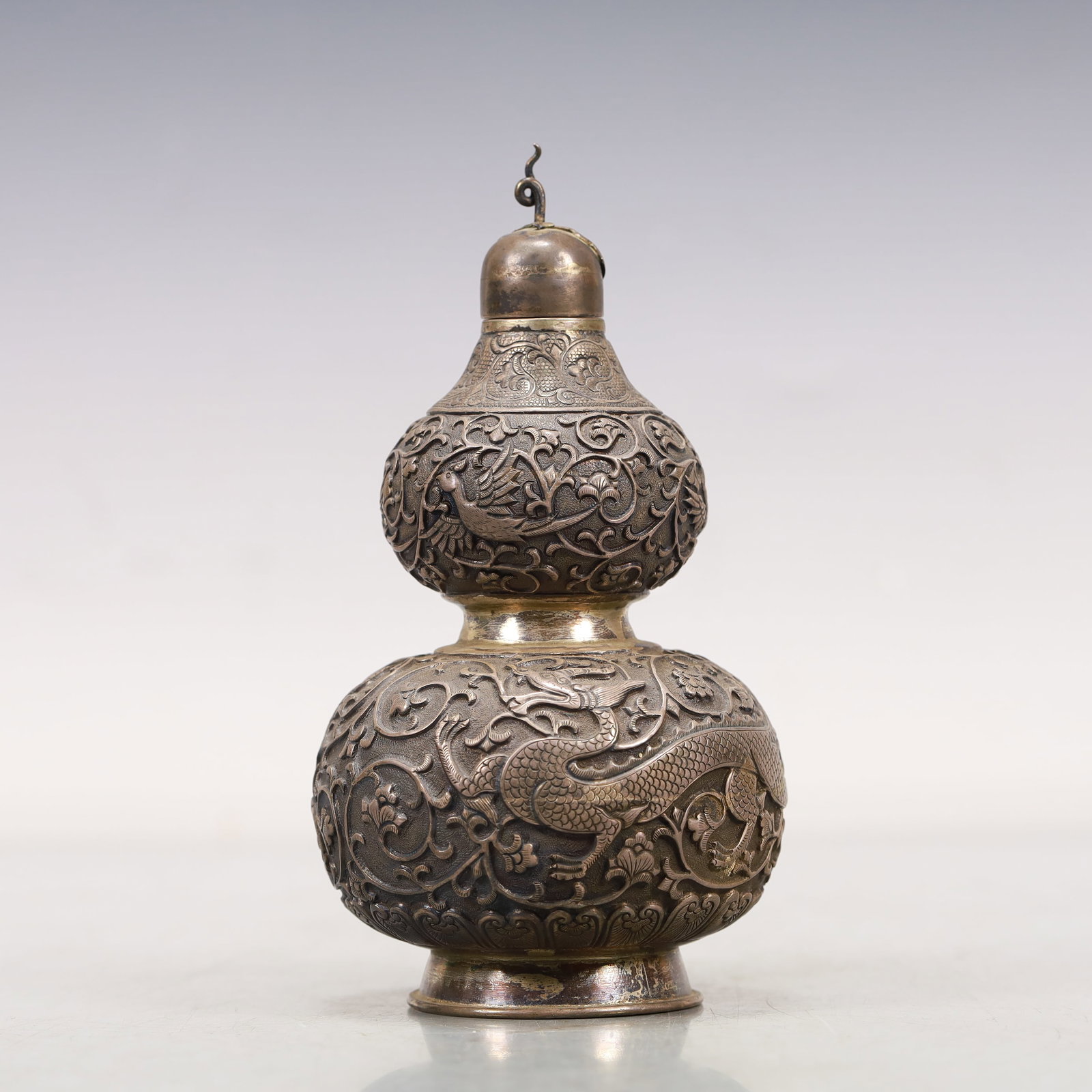 A Precious Silver 'Scrolling Lotus& Dragon' Gourd-Form Vase: A Precious Silver 'Scrolling Lotus& Dragon' Gourd-Form Vase. Cast with scaly,sinuous dragons. Chinese Qing Dynasty. Size:3.1inx5.5in. Weight:245g. 清代