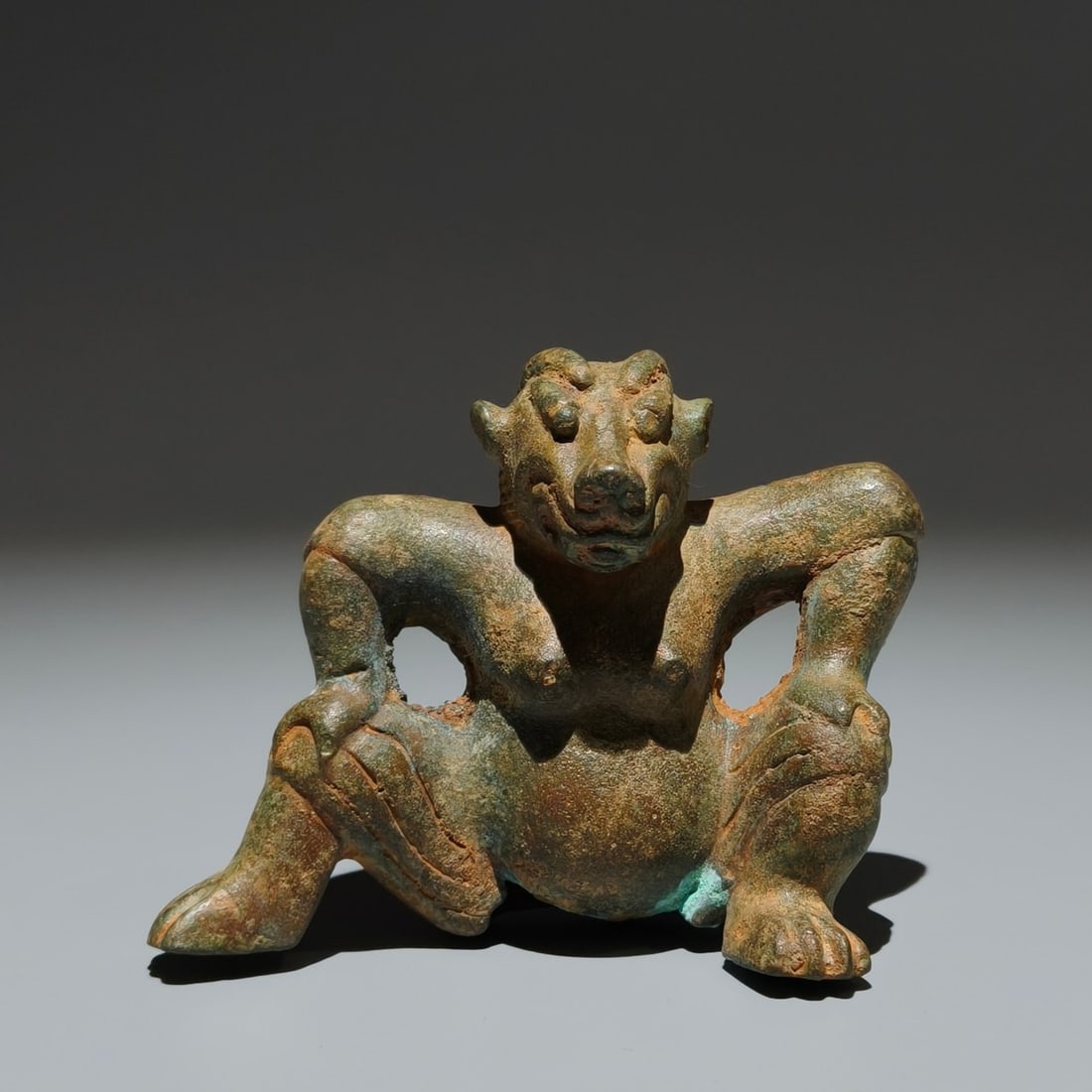 An Archaic Bronze Beast Ornament: An Archaic Bronze Beast Ornament,the Warring States period in China,Size:3.1inx3.5inx1.8in 青铜兽摆件,中国战国时期