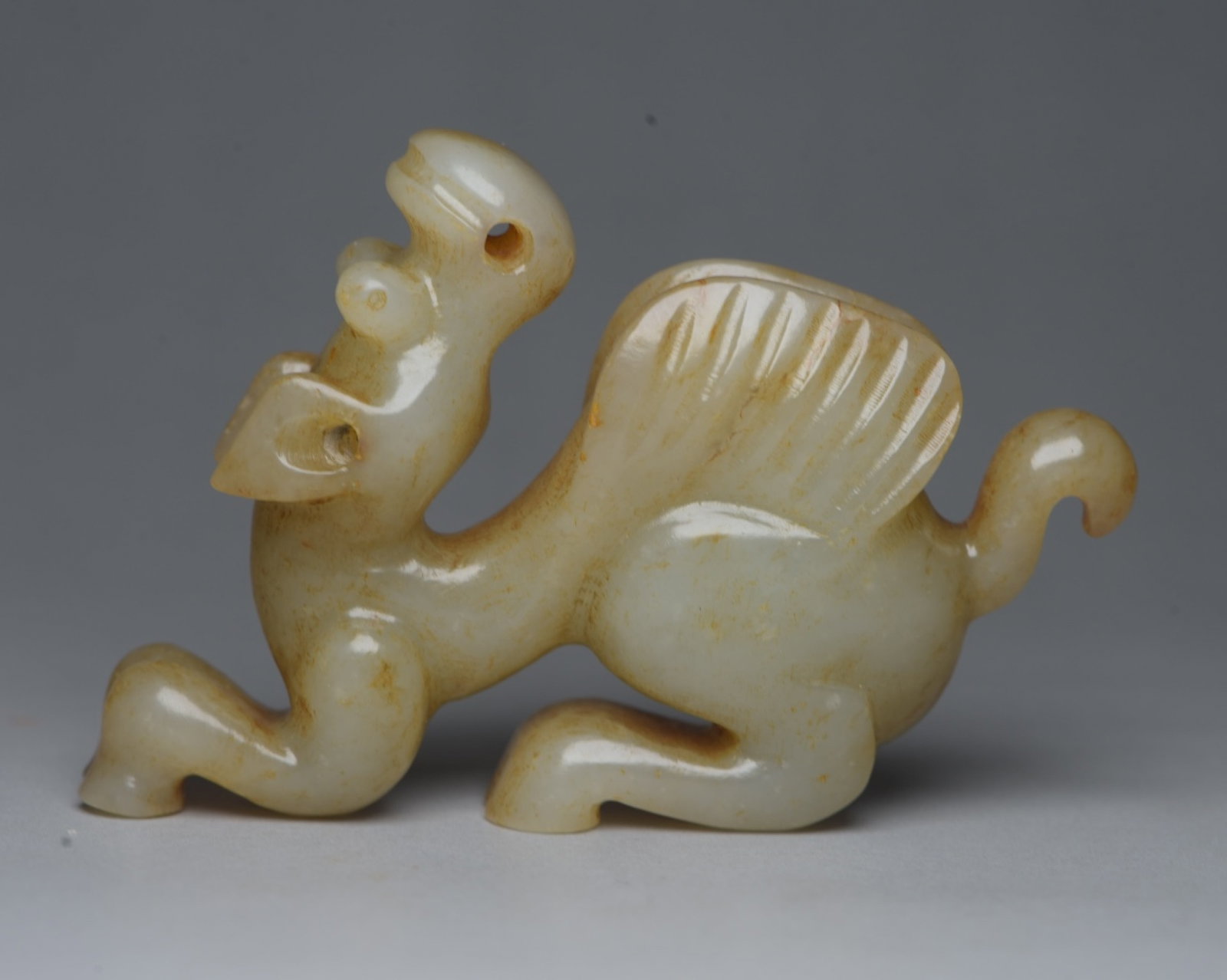 An Exquisite White Jade Pig and Dragon Ornament: An Exquisite White Jade Pig and Dragon Ornament,Qing Dynasty,China,Size:3.2inx2.2inx0.7in,Weight:106g 白玉猪龙摆件,中国清代