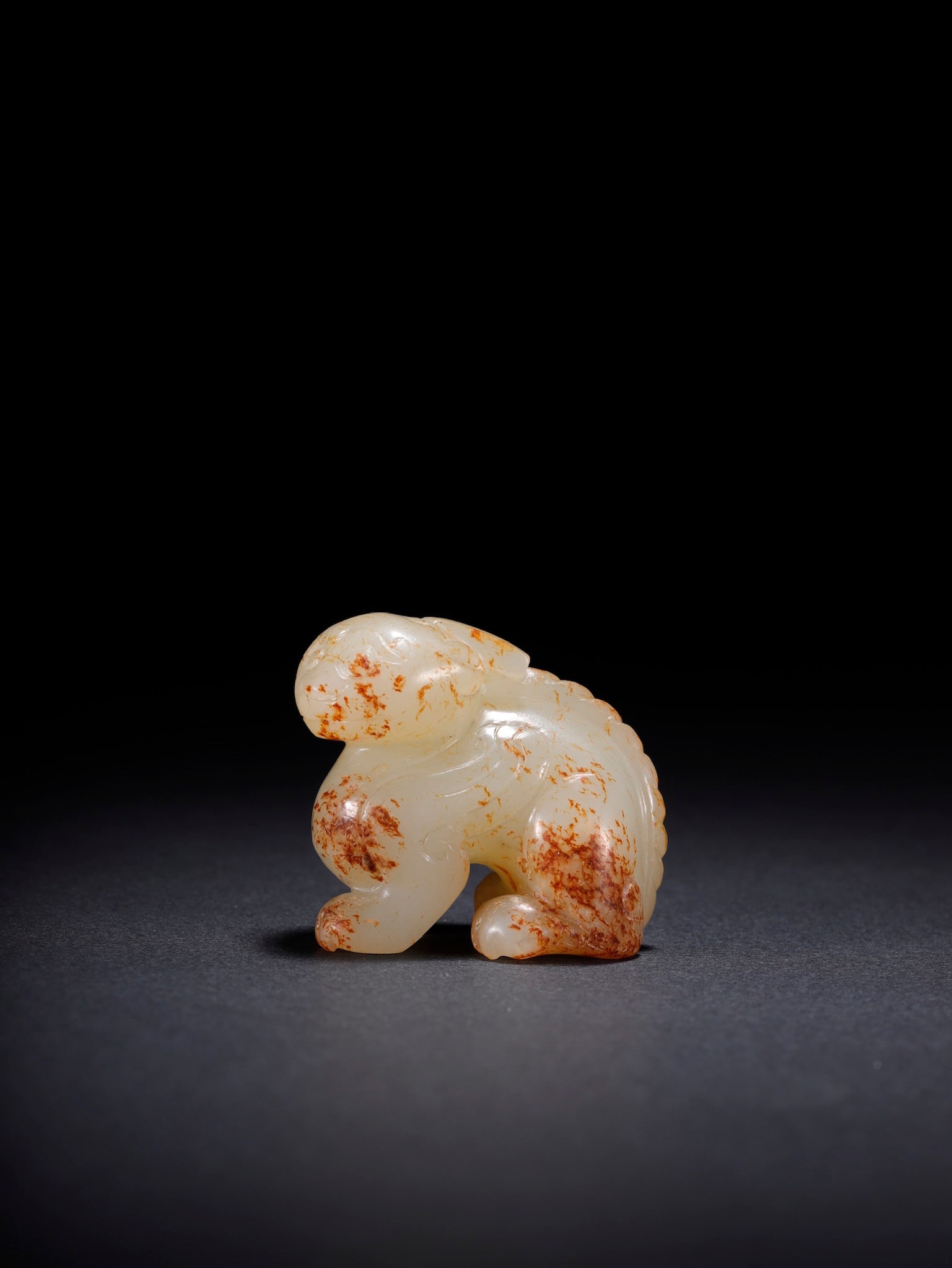 An Exquisite White Jade Auspicious Beast Ornament: An Exquisite White Jade Auspicious Beast Ornament,Song Dynasty,China,Size:1.5inx0.9inx1.4in,Weight:42.6g