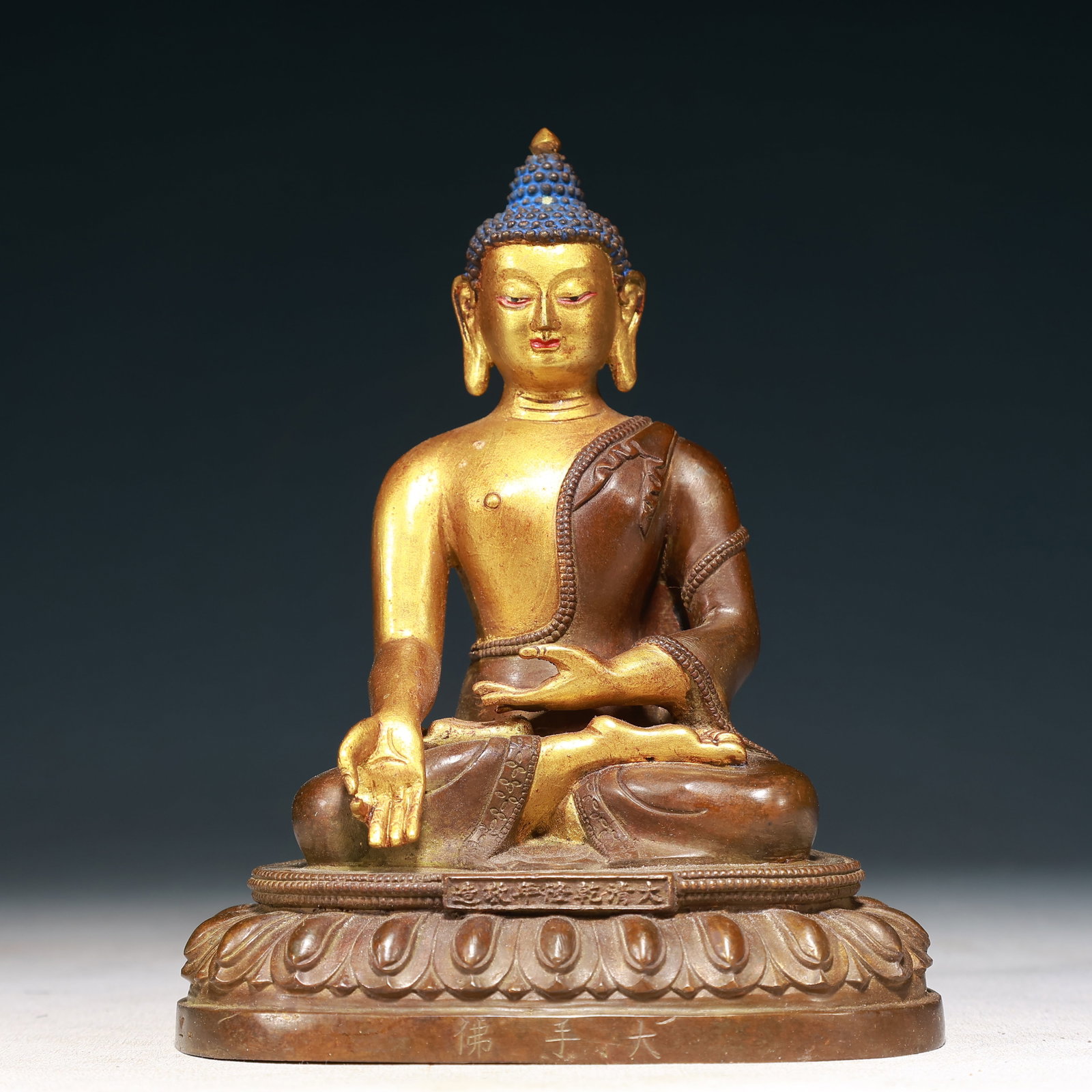 A Solemn Gilt Bronze Statue of Sakyamuni: A Solemn Gilt Bronze Statue of Sakyamuni,Qing Dynasty,China,Qianlong Mark,Size:5.1inx3.5inx6.7in,Weight:1150g 铜鎏金释迦摩尼像,中国清&