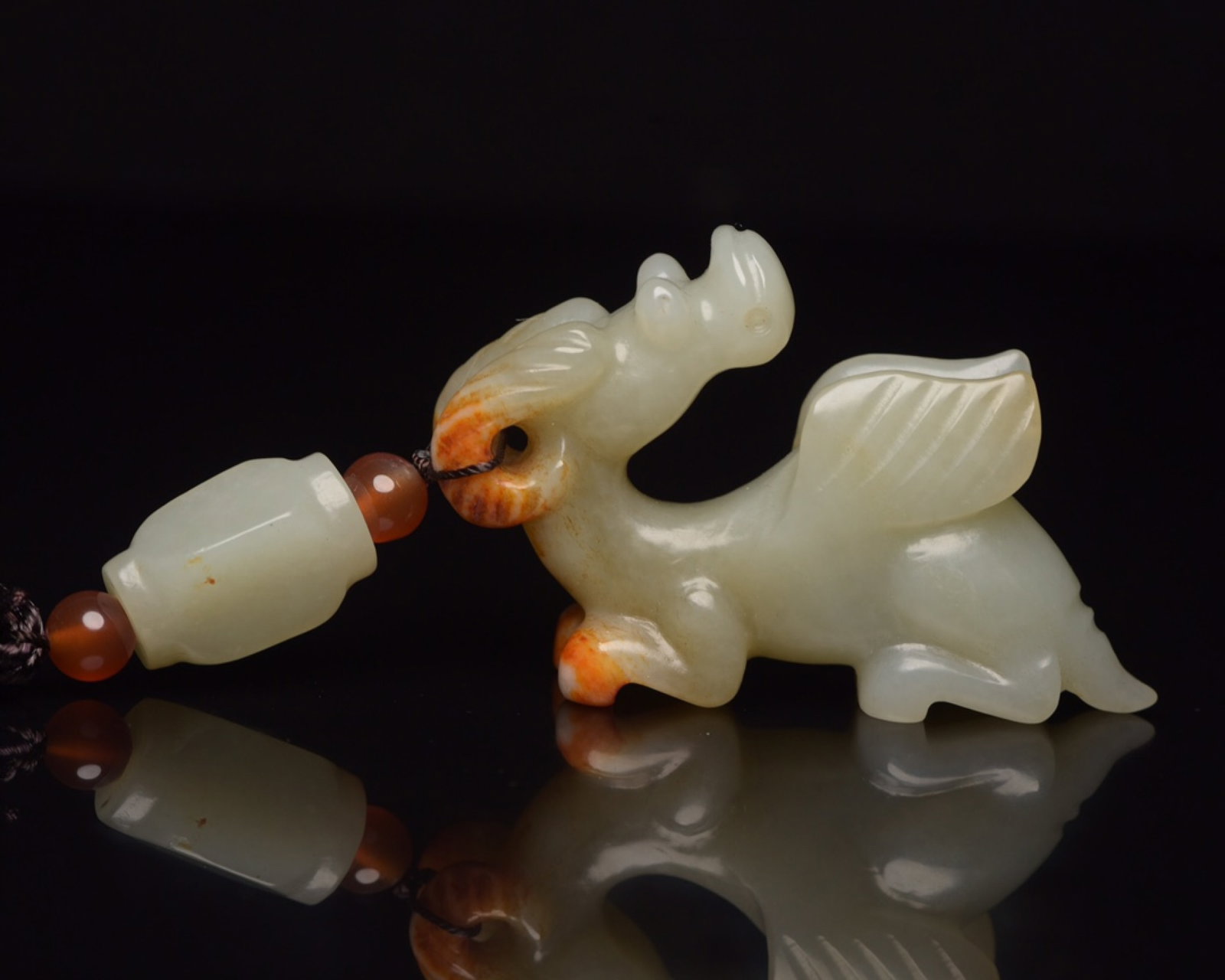 An Exquisite White Jade Beast Pendant: An Exquisite White Jade Beast Pendant,Qing Dynasty,China,Size:3.9inx1.7inx0.6in,Weight:61g 白玉兽挂件,中国清代
